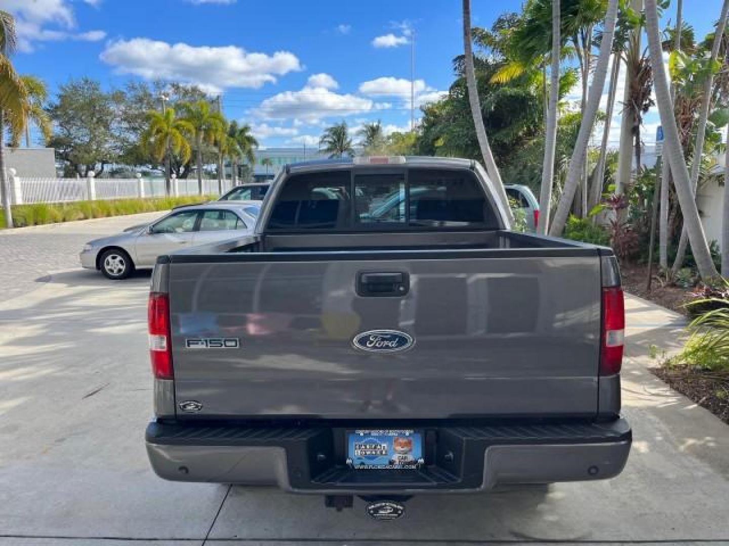 2005 Dark Shadow Grey Metallic /Black Ford F-150 1 FL FX4 4X4 LOW MILES 80,488 (1FTPW14535K) with an 5.4L 3v EFI V8 Engine engine, Automatic transmission, located at 4701 North Dixie Hwy, Pompano Beach, FL, 33064, (954) 422-2889, 26.240938, -80.123474 - OUR WEBPAGE FLORIDACARS1.COM HAS OVER 100 PHOTOS AND FREE CARFAX LINK 2005 FORD F-150 XLT ROAD READY 5.4L V8 VIN: 1FTPW14535KE86307 FX4 NO ACCIDENTS 4X4 CREW PICKUP BLUETOOTH NAVI NO RECALLS 1 OWNER FL 5.4L V8 F SOHC POWER SUNROOF 5,6FT BED LENGTH GASOLINE POWER LEATHER SEATS LOW MILES 80,488 REAR W - Photo#6