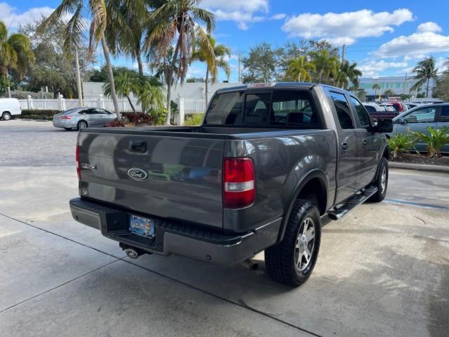 2005 Dark Shadow Grey Metallic /Black Ford F-150 1 FL FX4 4X4 LOW MILES 80,488 (1FTPW14535K) with an 5.4L 3v EFI V8 Engine engine, Automatic transmission, located at 4701 North Dixie Hwy, Pompano Beach, FL, 33064, (954) 422-2889, 26.240938, -80.123474 - OUR WEBPAGE FLORIDACARS1.COM HAS OVER 100 PHOTOS AND FREE CARFAX LINK 2005 FORD F-150 XLT ROAD READY 5.4L V8 VIN: 1FTPW14535KE86307 FX4 NO ACCIDENTS 4X4 CREW PICKUP BLUETOOTH NAVI NO RECALLS 1 OWNER FL 5.4L V8 F SOHC POWER SUNROOF 5,6FT BED LENGTH GASOLINE POWER LEATHER SEATS LOW MILES 80,488 REAR W - Photo#7