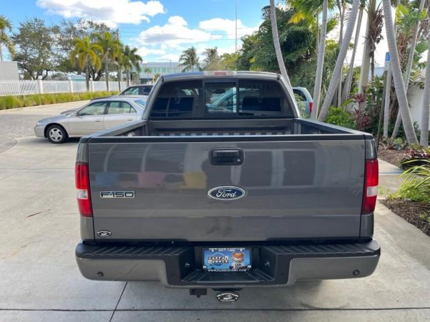 2005 Dark Shadow Grey Metallic /Black Ford F-150 1 FL FX4 4X4 LOW MILES 80,488 (1FTPW14535K) with an 5.4L 3v EFI V8 Engine engine, Automatic transmission, located at 4701 North Dixie Hwy, Pompano Beach, FL, 33064, (954) 422-2889, 26.240938, -80.123474 - OUR WEBPAGE FLORIDACARS1.COM HAS OVER 100 PHOTOS AND FREE CARFAX LINK 2005 FORD F-150 XLT ROAD READY 5.4L V8 VIN: 1FTPW14535KE86307 FX4 NO ACCIDENTS 4X4 CREW PICKUP BLUETOOTH NAVI NO RECALLS 1 OWNER FL 5.4L V8 F SOHC POWER SUNROOF 5,6FT BED LENGTH GASOLINE POWER LEATHER SEATS LOW MILES 80,488 REAR W - Photo#95