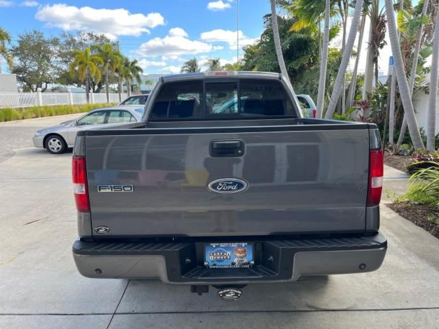 2005 Dark Shadow Grey Metallic /Black Ford F-150 1 FL FX4 4X4 LOW MILES 80,488 (1FTPW14535K) with an 5.4L 3v EFI V8 Engine engine, Automatic transmission, located at 4701 North Dixie Hwy, Pompano Beach, FL, 33064, (954) 422-2889, 26.240938, -80.123474 - OUR WEBPAGE FLORIDACARS1.COM HAS OVER 100 PHOTOS AND FREE CARFAX LINK 2005 FORD F-150 XLT ROAD READY 5.4L V8 VIN: 1FTPW14535KE86307 FX4 NO ACCIDENTS 4X4 CREW PICKUP BLUETOOTH NAVI NO RECALLS 1 OWNER FL 5.4L V8 F SOHC POWER SUNROOF 5,6FT BED LENGTH GASOLINE POWER LEATHER SEATS LOW MILES 80,488 REAR W - Photo#98