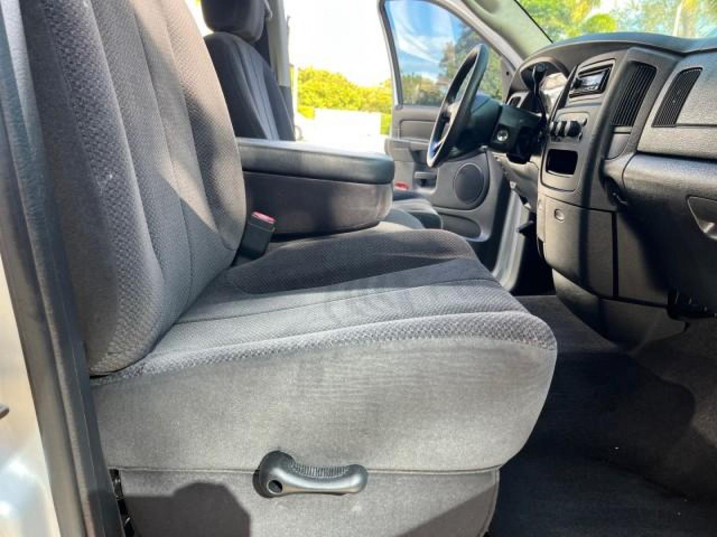 2003 Bright Silver Metallic /Dark Slate Gray Dodge Ram 1500 CREW HEMI SLT LOW MILES 78,951 (1D7HA18D13S) with an 5.7L V8 Hemi Magnum Engine engine, Automatic transmission, located at 4701 North Dixie Hwy, Pompano Beach, FL, 33064, (954) 422-2889, 26.240938, -80.123474 - OUR WEBPAGE FLORIDACARS1.COM HAS OVER 100 PHOTOS AND FREE CARFAX LINK 2003 DODGE RAM 1500 SLT ROAD READY 5.7L V8 VIN: 1D7HA18D13S364293 NO RECALLS 4 DOOR EXTENDED CAB PICKUP FLORIDA OWNER 5.7L V8 F LOW MILES 78,951 GASOLINE POWER SEATS REAR WHEEL DRIVE 6.4FT BED LENGHT Approach Lights Chrome Wheels - Photo#26