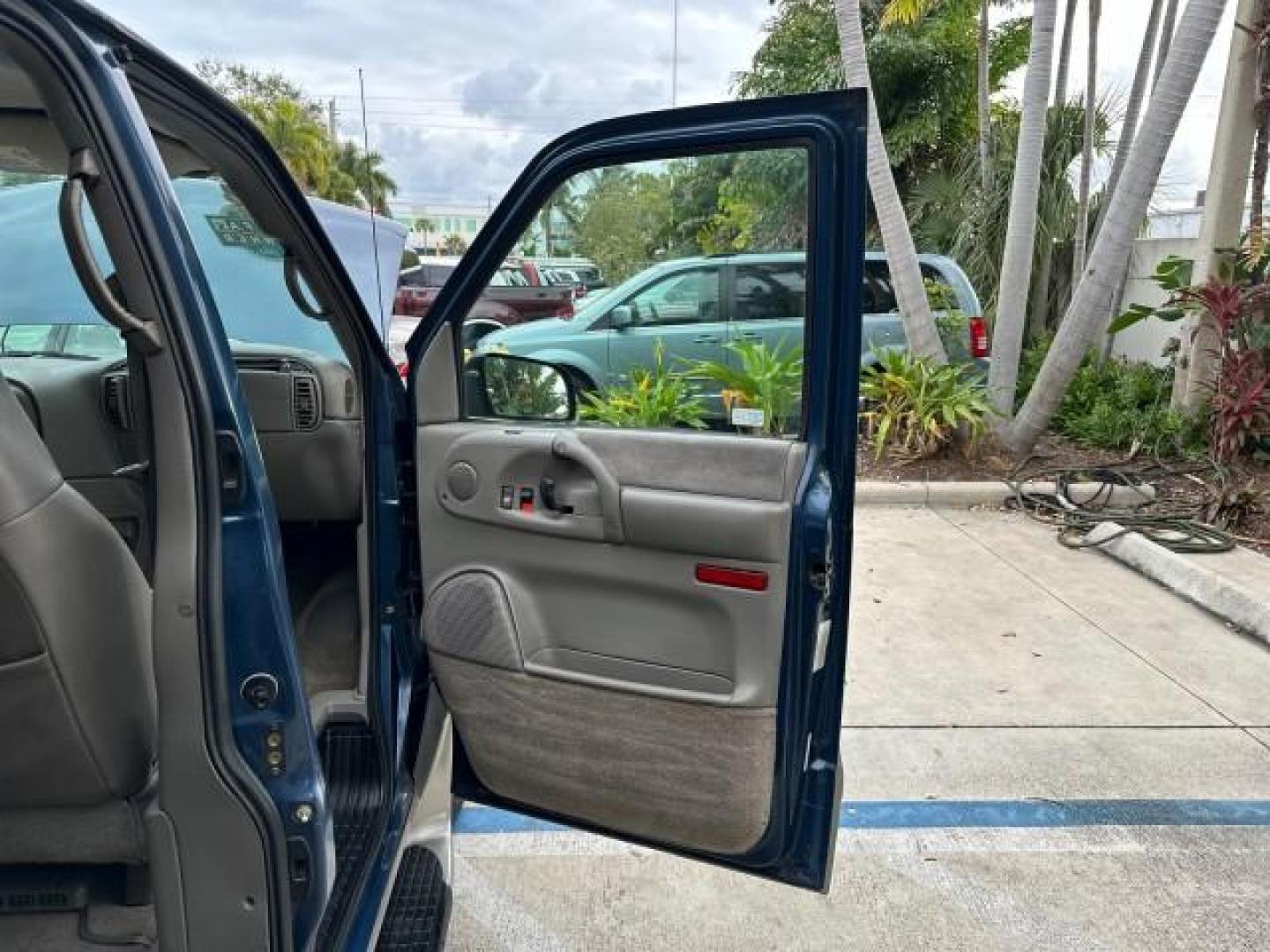 2005 Medium Cadet Blue Metallic /Medium Gray Chevrolet Astro Passenger AWD LOW MILES 68,902 1 OWNER (1GNEL19X35B) with an 4.3L Vortec 4300 V6 MFI Engine engine, Automatic transmission, located at 4701 North Dixie Hwy, Pompano Beach, FL, 33064, (954) 422-2889, 26.240938, -80.123474 - OUR WEBPAGE FLORIDACARS1.COM HAS 100 PHOTOS AND FREE CARFAX LINK 2005 CHEVROLET ASTRO 7 PASSENGER VIN: 1GNEL19X35B105007 VAN 4.3L V6 F GASOLINE HANDICAP LIFT ALL WHEEL DRIVE AWD Automatic Climate Control Cruise Control Front Bucket Seats Limited Slip Differential Rear Privacy Glass Trailer Wiring TH - Photo#12