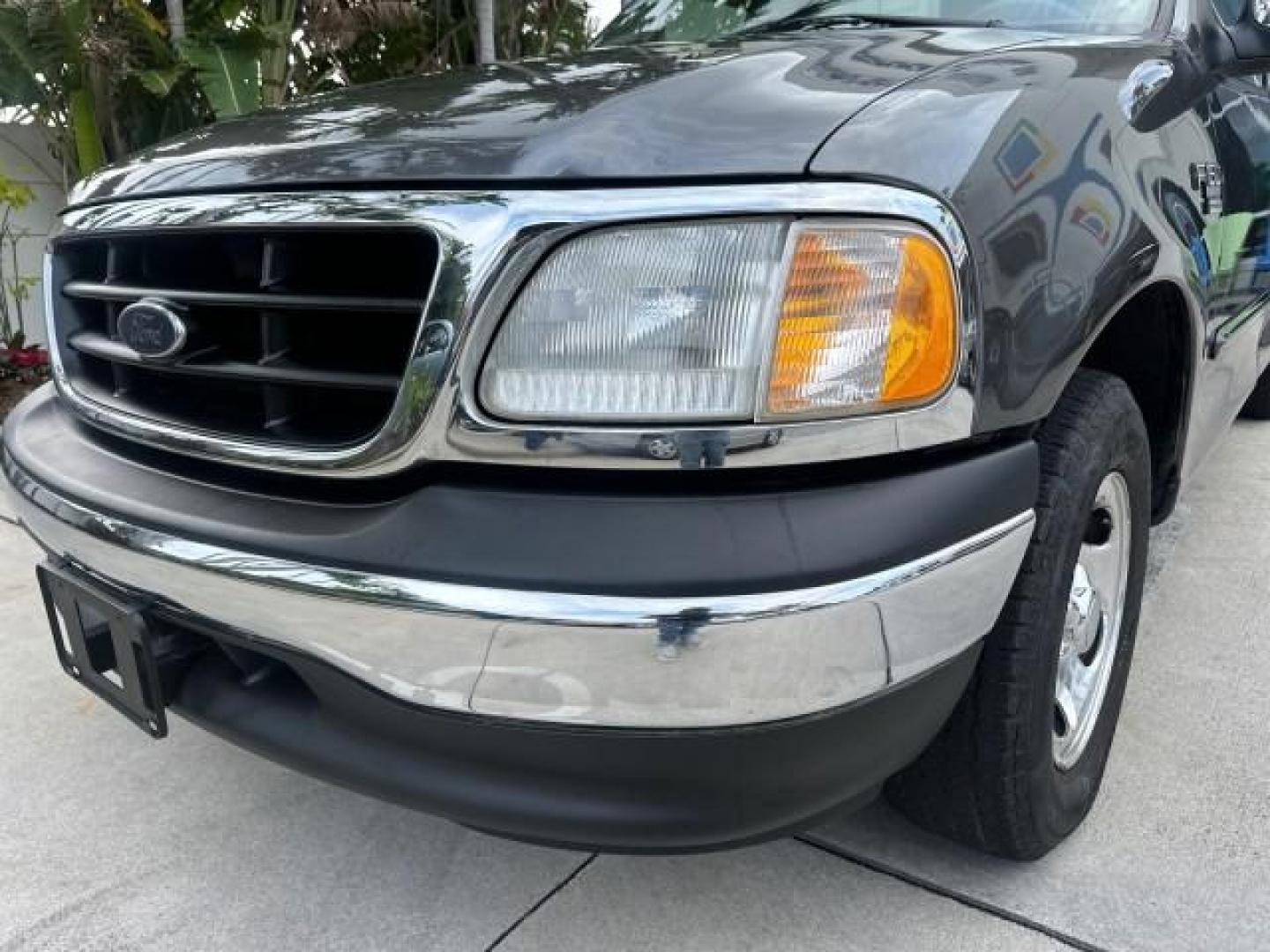 2002 Dark Shadow Grey Metallic /Medium Graphite Ford F-150 XL LOW MILES 56,147 AC (1FTRF17W82N) with an 4.6L SEFI OHC V8 Triton Engine engine, Automatic transmission, located at 4701 North Dixie Hwy, Pompano Beach, FL, 33064, (954) 422-2889, 26.240938, -80.123474 - OUR WEBPAGE FLORIDACARS1.COM HAS OVER 100 PHOTOS AND FREE CARFAX LINK 2002 FORD F-150 XL VIN: 1FTRF17W82NA79722 PICKUP 4.6L V8 F SOHC 16V GASOLINE REAR WHEEL DRIVE 8FT BED LINE-X Bed Liner Long Bed Cloth Seats Tow Hitch THIS IS ONE OF THE NICEST FORDS WE HAVE EVER LISTED, 1 OWNER! TRUCK HAS A 8FT BE - Photo#29