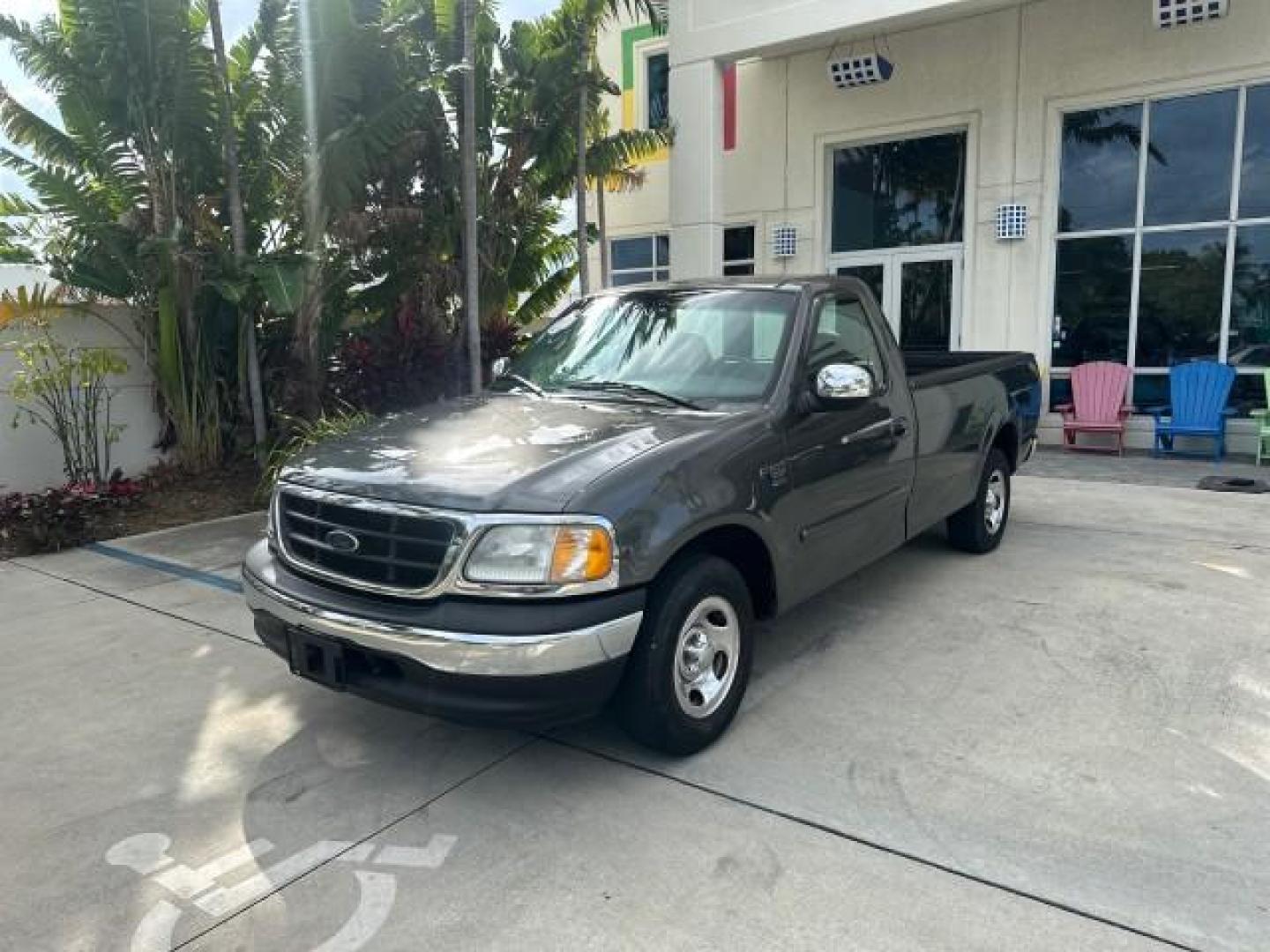 2002 Dark Shadow Grey Metallic /Medium Graphite Ford F-150 XL LOW MILES 56,147 AC (1FTRF17W82N) with an 4.6L SEFI OHC V8 Triton Engine engine, Automatic transmission, located at 4701 North Dixie Hwy, Pompano Beach, FL, 33064, (954) 422-2889, 26.240938, -80.123474 - OUR WEBPAGE FLORIDACARS1.COM HAS OVER 100 PHOTOS AND FREE CARFAX LINK 2002 FORD F-150 XL VIN: 1FTRF17W82NA79722 PICKUP 4.6L V8 F SOHC 16V GASOLINE REAR WHEEL DRIVE 8FT BED LINE-X Bed Liner Long Bed Cloth Seats Tow Hitch THIS IS ONE OF THE NICEST FORDS WE HAVE EVER LISTED, 1 OWNER! TRUCK HAS A 8FT BE - Photo#3