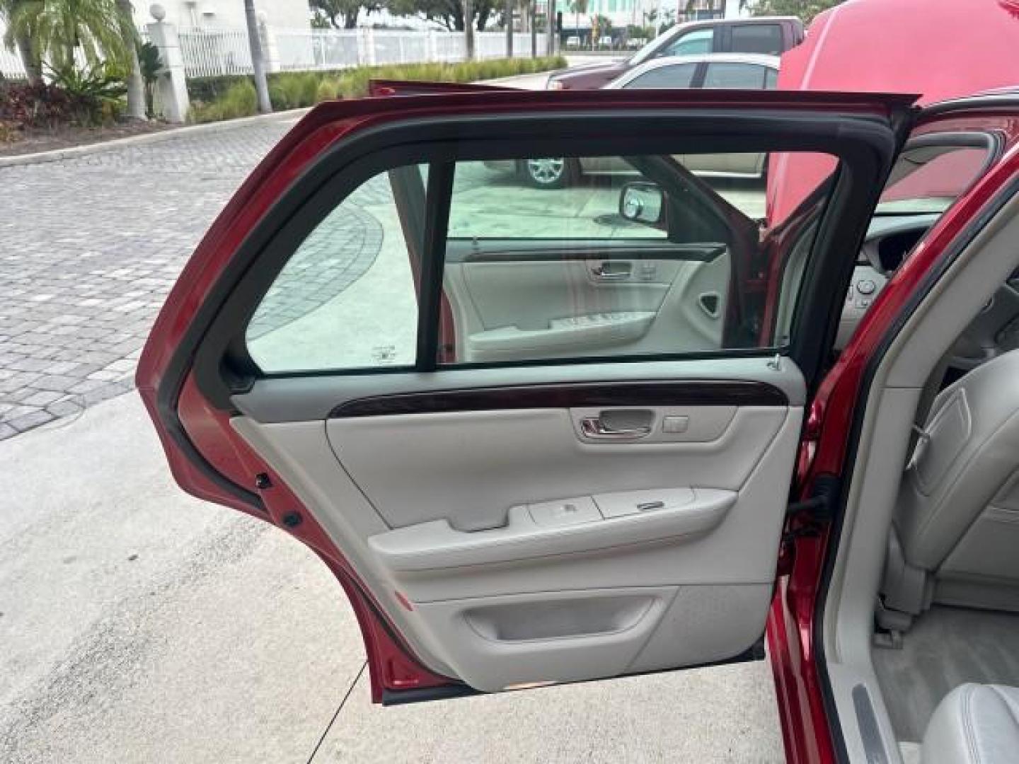 2010 Crystal Red Tintcoat /Titanium/Dark Titanium Cadillac DTS Low Miles 25,493 Sunroof (1G6KD5EY9AU) with an Northstar 4.6L DOHC V8 Engine engine, Automatic transmission, located at 4701 North Dixie Hwy, Pompano Beach, FL, 33064, (954) 422-2889, 26.240938, -80.123474 - OUR WEBPAGE FLORIDACARS1.COM HAS OVER 100 PHOTOS AND FREE CARFAX LINK 2010 CADILLAC DTS LUXURY COLLECTION CRYSTAL RED TRICOAT BEAUTIFUL VIN: 1G6KD5EY9AU108445 SEDAN 4 DR 4.6L V8 F DOHC 32V GASOLINE FRONT WHEEL DRIVE A/C Seat(s) Parking Sensors Alloy Wheels Rear Air Conditioning Front Seat Heaters Re - Photo#12