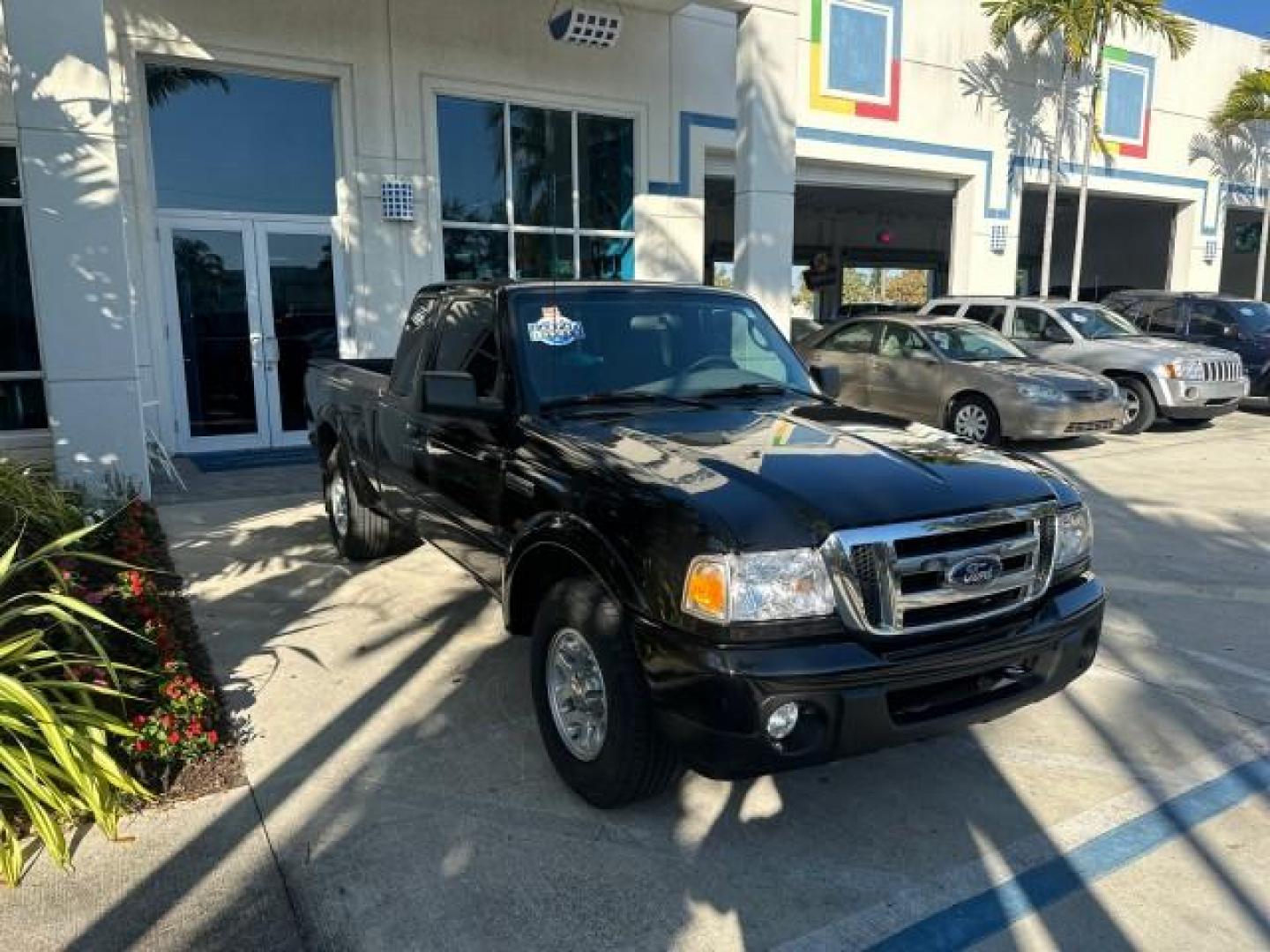 2010 Black /Medium Dark Flint Ford Ranger XLT4X4 LOW MILES 65,570 1 OWNER (1FTLR4FE4AP) with an 4.0L SOHC V6 Engine engine, Automatic transmission, located at 4701 North Dixie Hwy, Pompano Beach, FL, 33064, (954) 422-2889, 26.240938, -80.123474 - OUR WEBPAGE FLORIDACARS1.COM HAS OVER 100 PHOTOS AND FREE CARFAX LINK 2010 FORD RANGER XLT VIN: 1FTLR4FE4APA50079 4 DOOR EXTENDED CAB PICKUP 4.0L V6 F SOHC 12V GASOLINE REAR WHEEL DRIVE W/ 4X4 4WD/AWD Cloth Seats Alloy Wheels Satellite Radio Ready Bed Liner THIS IS ONE OF THE NICEST FORDS WE HAVE EV - Photo#1