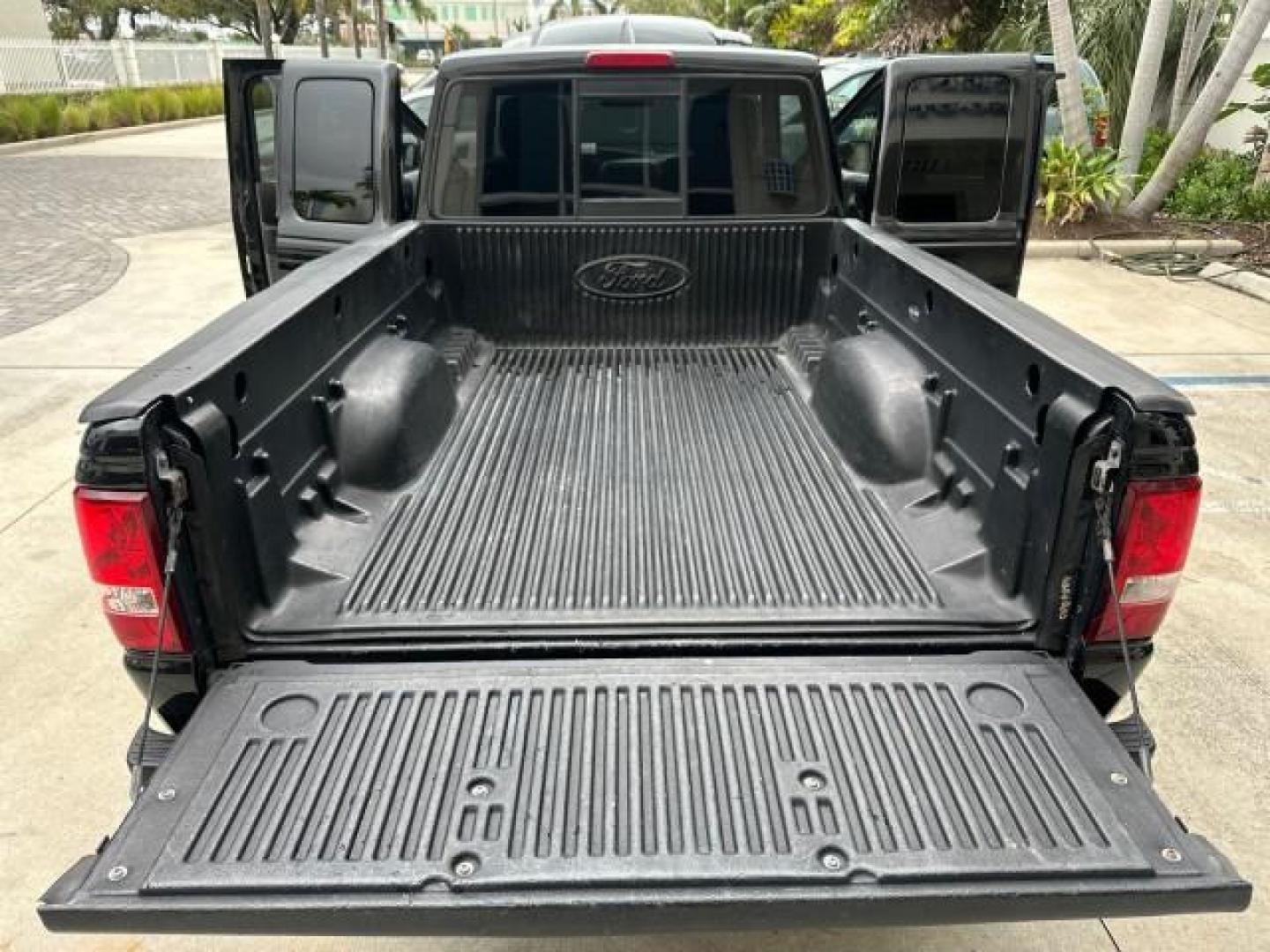 2010 Black /Medium Dark Flint Ford Ranger XLT4X4 LOW MILES 65,570 1 OWNER (1FTLR4FE4AP) with an 4.0L SOHC V6 Engine engine, Automatic transmission, located at 4701 North Dixie Hwy, Pompano Beach, FL, 33064, (954) 422-2889, 26.240938, -80.123474 - OUR WEBPAGE FLORIDACARS1.COM HAS OVER 100 PHOTOS AND FREE CARFAX LINK 2010 FORD RANGER XLT VIN: 1FTLR4FE4APA50079 4 DOOR EXTENDED CAB PICKUP 4.0L V6 F SOHC 12V GASOLINE REAR WHEEL DRIVE W/ 4X4 4WD/AWD Cloth Seats Alloy Wheels Satellite Radio Ready Bed Liner THIS IS ONE OF THE NICEST FORDS WE HAVE EV - Photo#17