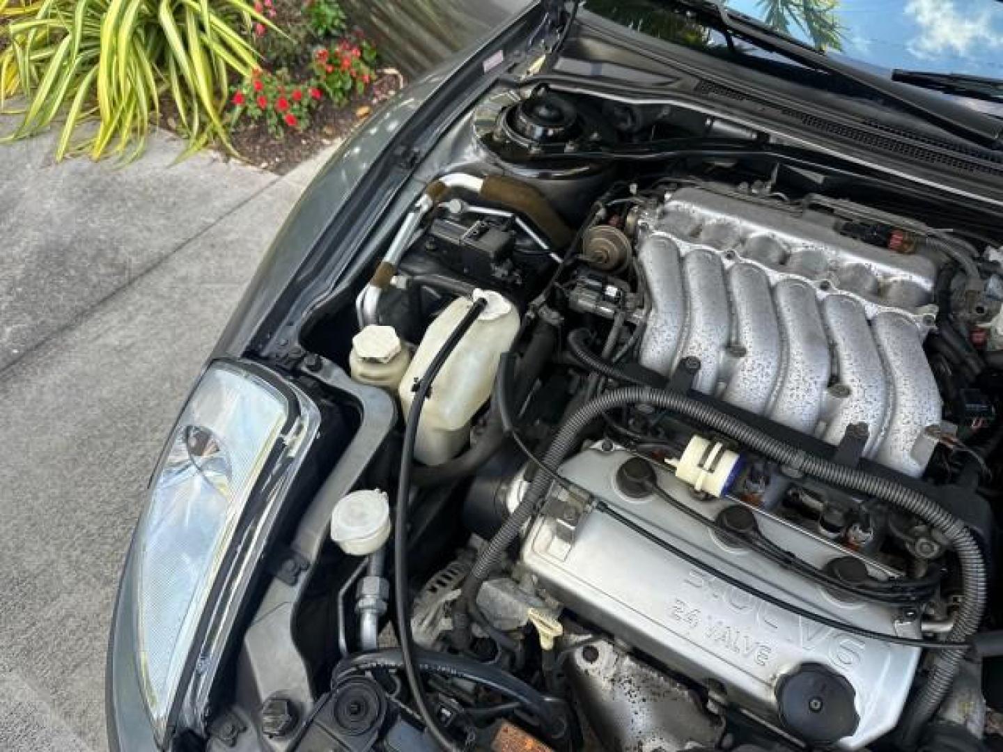 2004 Titanium Pearl /Midnight Mitsubishi Eclipse GTS SPYDER LOW MILES 36,896 CONV (4A3AE75H04E) with an 3.0L SOHC MPFI 24-Valve V6 Variable Induction Engine engine, Automatic transmission, located at 4701 North Dixie Hwy, Pompano Beach, FL, 33064, (954) 422-2889, 26.240938, -80.123474 - OUR WEBPAGE FLORIDACARS1.COM HAS OVER 100 PHOTOS AND FREE CARFAX LINK 2004 MITSUBISHI ECLIPSE SPYDER GTS VIN: 4A3AE75H04E031350 CONVERTIBLE 3.0L V6 F DOHC 24V GASOLINE FRONT WHEEL DRIVE THIS IS ONE OF THE NICEST MITSUBISHI S WE HAVE EVER LISTED, CLEAN FLORIDA TITLE. BRAND NEW THIS VEHICLE COST $27,2 - Photo#35