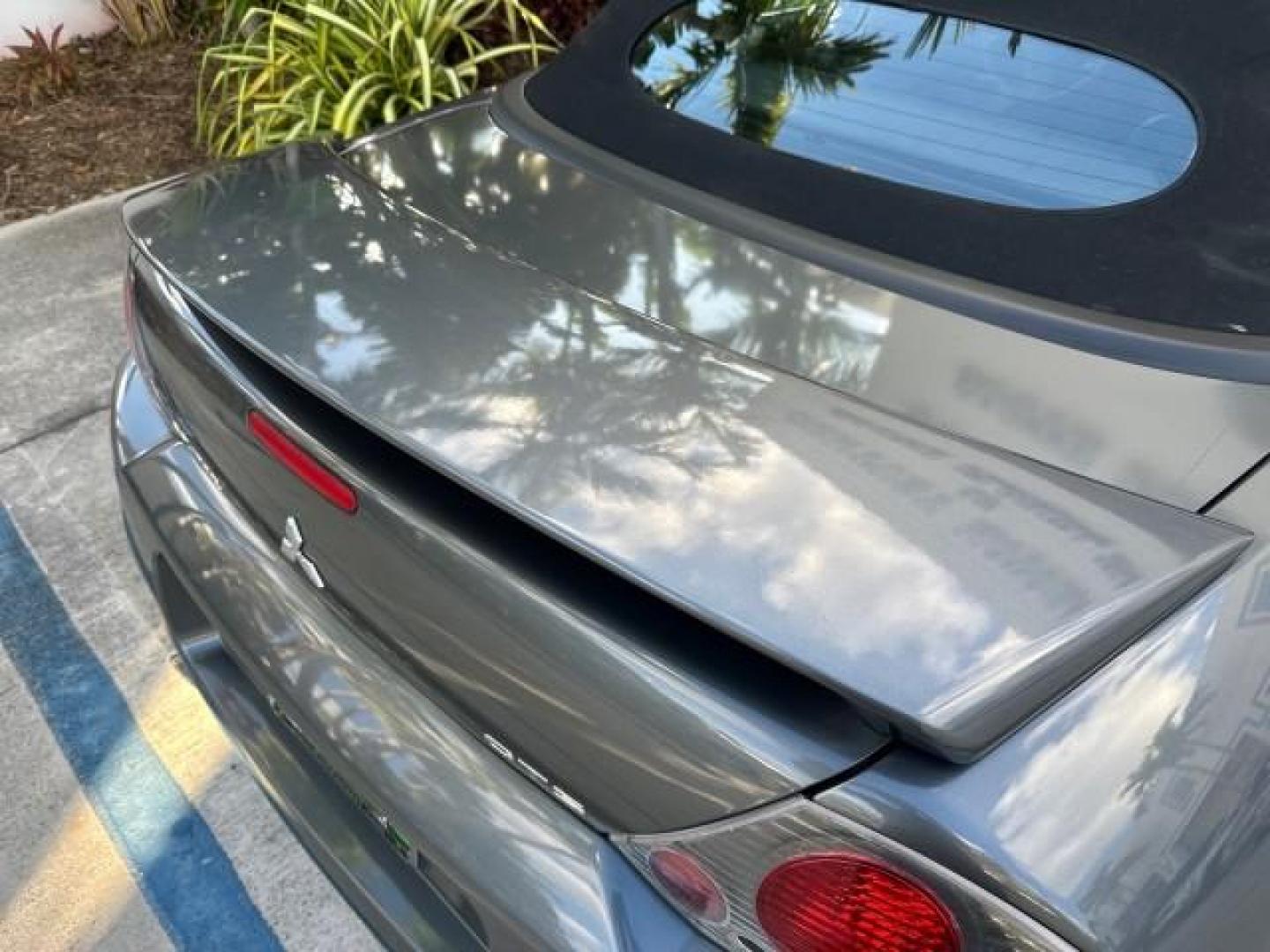 2004 Titanium Pearl /Midnight Mitsubishi Eclipse GTS SPYDER LOW MILES 36,896 CONV (4A3AE75H04E) with an 3.0L SOHC MPFI 24-Valve V6 Variable Induction Engine engine, Automatic transmission, located at 4701 North Dixie Hwy, Pompano Beach, FL, 33064, (954) 422-2889, 26.240938, -80.123474 - OUR WEBPAGE FLORIDACARS1.COM HAS OVER 100 PHOTOS AND FREE CARFAX LINK 2004 MITSUBISHI ECLIPSE SPYDER GTS VIN: 4A3AE75H04E031350 CONVERTIBLE 3.0L V6 F DOHC 24V GASOLINE FRONT WHEEL DRIVE THIS IS ONE OF THE NICEST MITSUBISHI S WE HAVE EVER LISTED, CLEAN FLORIDA TITLE. BRAND NEW THIS VEHICLE COST $27,2 - Photo#53