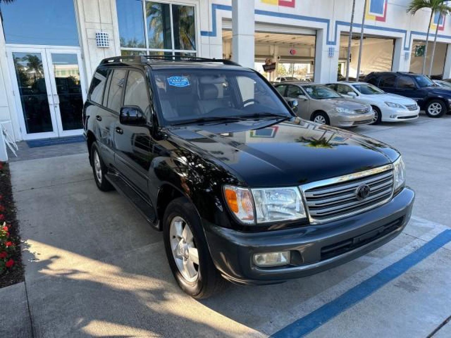 2003 Black Garnet Pearl /Stone Toyota Land Cruiser 4X4 18 SERVICE RECORDS NEW TIMING (JTEHT05JX32) with an 4.7L DOHC EFI 32-Valve V8 Engine engine, Automatic transmission, located at 4701 North Dixie Hwy, Pompano Beach, FL, 33064, (954) 422-2889, 26.240938, -80.123474 - OUR WEBPAGE FLORIDACARS1.COM HAS OVER 100 PHOTOS AND FREE CARFAX LINK 2003 TOYOTA LAND CRUISER VIN: JTEHT05JX32048900 J T E H T 0 5 J X 3 2 0 4 8 9 0 0 4 DOOR WAGON/SPORT UTILITY 4.7L V8 F DOHC 32V GASOLINE ALL WHEEL DRIVE NEW TIMING 10/17/2019 124,356 Toyota of Deerfield Beach Deerfield Beach, Flor - Photo#1