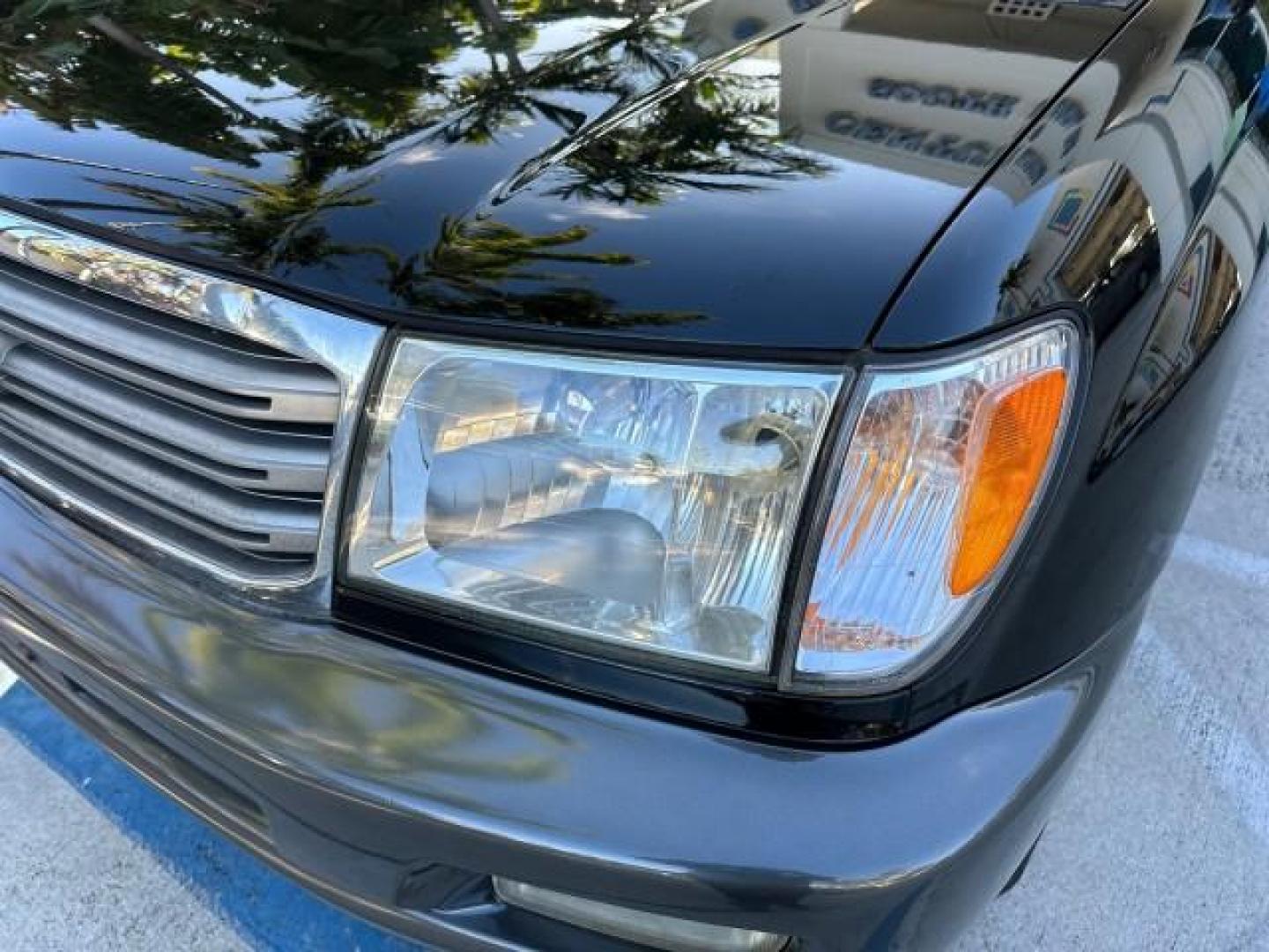 2003 Black Garnet Pearl /Stone Toyota Land Cruiser 4X4 18 SERVICE RECORDS NEW TIMING (JTEHT05JX32) with an 4.7L DOHC EFI 32-Valve V8 Engine engine, Automatic transmission, located at 4701 North Dixie Hwy, Pompano Beach, FL, 33064, (954) 422-2889, 26.240938, -80.123474 - OUR WEBPAGE FLORIDACARS1.COM HAS OVER 100 PHOTOS AND FREE CARFAX LINK 2003 TOYOTA LAND CRUISER VIN: JTEHT05JX32048900 J T E H T 0 5 J X 3 2 0 4 8 9 0 0 4 DOOR WAGON/SPORT UTILITY 4.7L V8 F DOHC 32V GASOLINE ALL WHEEL DRIVE NEW TIMING 10/17/2019 124,356 Toyota of Deerfield Beach Deerfield Beach, Flor - Photo#30