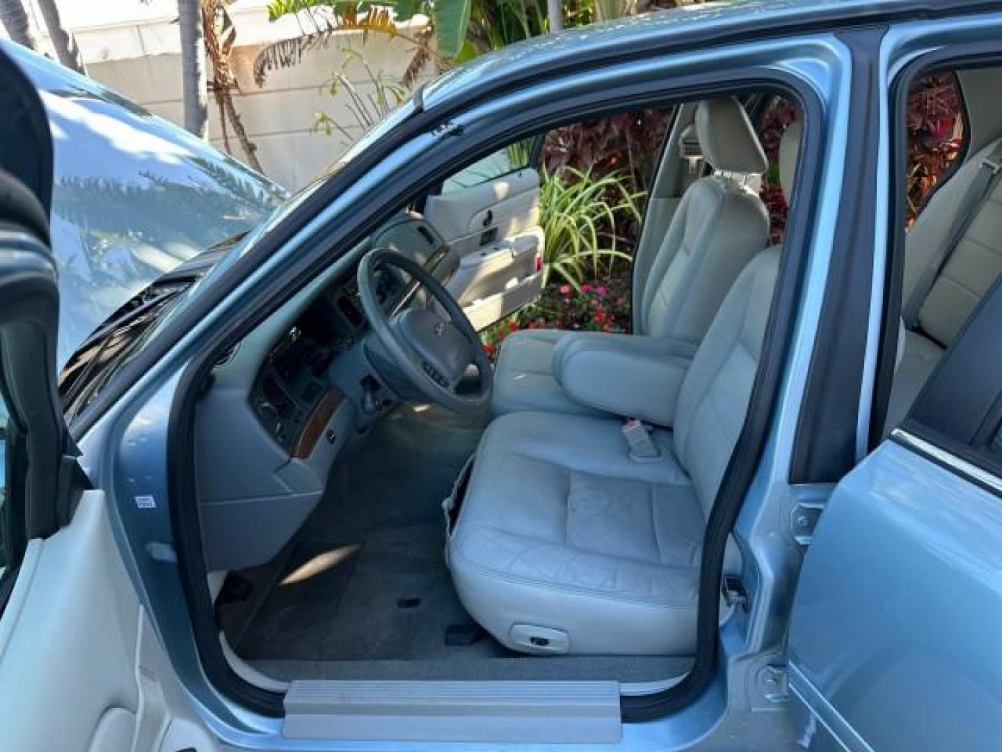 2003 Light Blue Metallic /Medium Parchment Ford Crown Victoria LX LOW MILES 31,713 (2FAFP74W53X) with an 4.6L SEFI OHC V8 Engine engine, Automatic transmission, located at 4701 North Dixie Hwy, Pompano Beach, FL, 33064, (954) 422-2889, 26.240938, -80.123474 - OUR WEBPAGE FLORIDACARS1.COM HAS OVER 100 PHOTOS AND FREE CARFAX LINK 2003 FORD CROWN VICTORIA LX VIN: 2FAFP74W53X100538 2 F A F P 7 4 W 5 3 X 1 0 0 5 3 8 SEDAN 4 DR 4.6L V8 F GASOLINE REAR WHEEL DRIVE Basic Features ABS Brakes CD Audio Power Mirrors Traction Control AM/FM Stereo Cassette Player Pow - Photo#10
