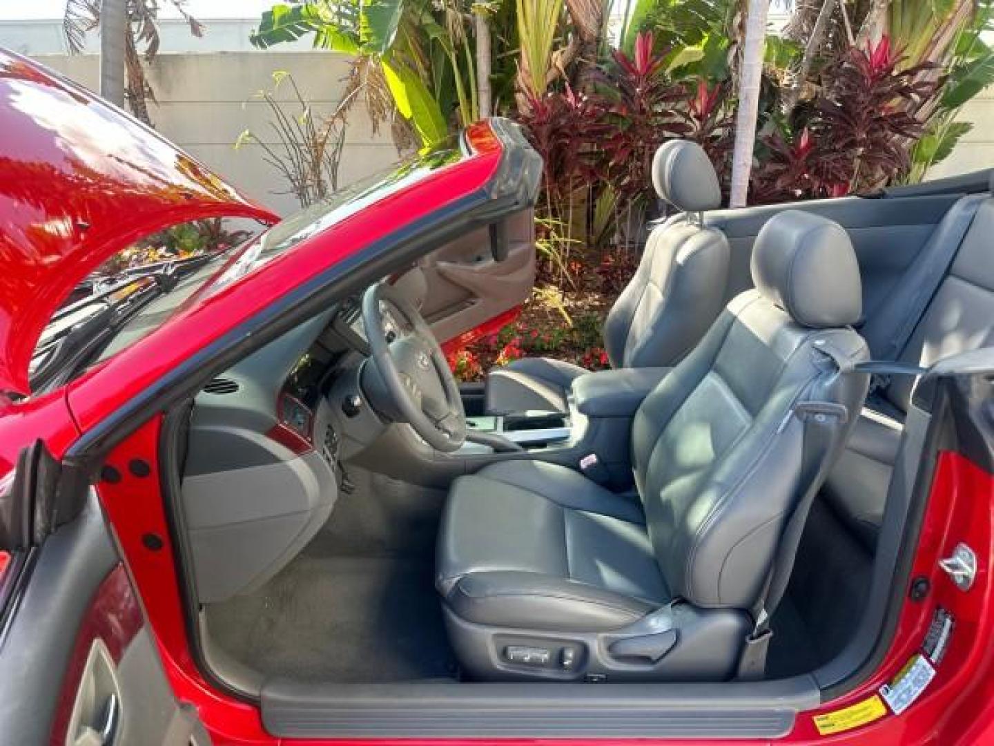 2004 Absolutely Red /Dark Stone Toyota Camry Solara 1 FL SLE LOW MILES 17,713 (4T1FA38P74U) with an 3.3L DOHC SMPI VVT-i 24-Valve V6 Engine engine, Automatic transmission, located at 4701 North Dixie Hwy, Pompano Beach, FL, 33064, (954) 422-2889, 26.240938, -80.123474 - OUR WEBPAGE FLORIDACARS1.COM HAS OVER 100 PHOTOS AND FREE CARFAX LINK 2004 TOYOTA CAMRY SOLARA SLE V6 VIN: 4T1FA38P74U024669 4 T 1 F A 3 8 P 7 4 U 0 2 4 6 6 9 CONVERTIBLE 3.3L V6 F DOHC 24V 29 MPG GASOLINE FRONT WHEEL DRIVE Top Features Alloy Wheels Leather Seats Front Seat Heaters Satellite Radio R - Photo#11