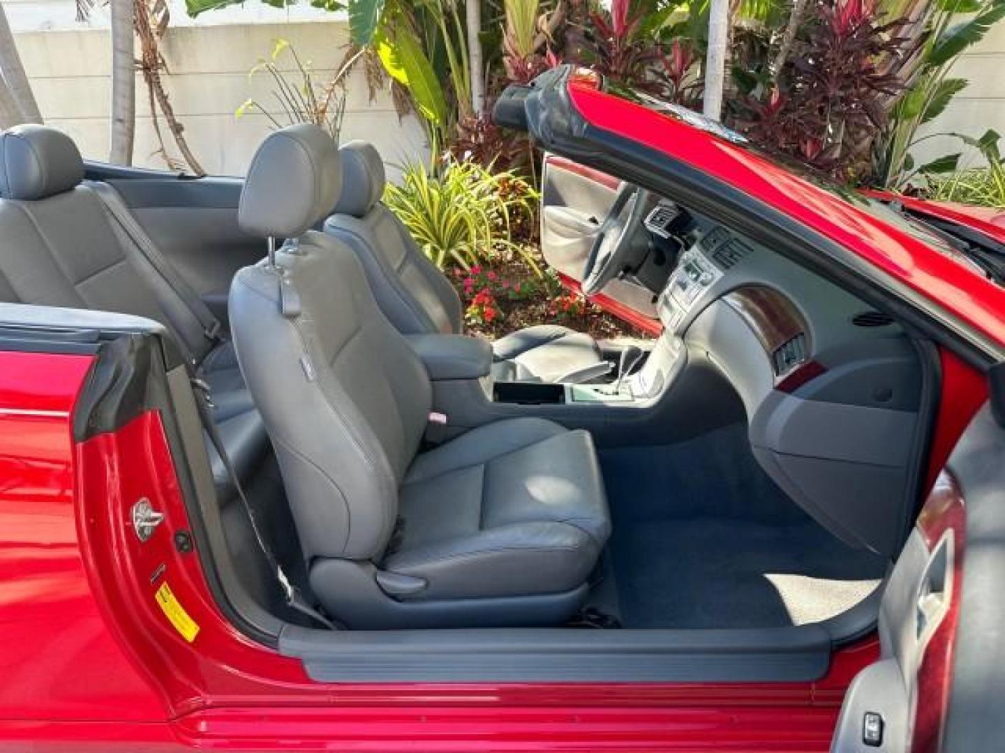 2004 Absolutely Red /Dark Stone Toyota Camry Solara 1 FL SLE LOW MILES 17,713 (4T1FA38P74U) with an 3.3L DOHC SMPI VVT-i 24-Valve V6 Engine engine, Automatic transmission, located at 4701 North Dixie Hwy, Pompano Beach, FL, 33064, (954) 422-2889, 26.240938, -80.123474 - OUR WEBPAGE FLORIDACARS1.COM HAS OVER 100 PHOTOS AND FREE CARFAX LINK 2004 TOYOTA CAMRY SOLARA SLE V6 VIN: 4T1FA38P74U024669 4 T 1 F A 3 8 P 7 4 U 0 2 4 6 6 9 CONVERTIBLE 3.3L V6 F DOHC 24V 29 MPG GASOLINE FRONT WHEEL DRIVE Top Features Alloy Wheels Leather Seats Front Seat Heaters Satellite Radio R - Photo#13