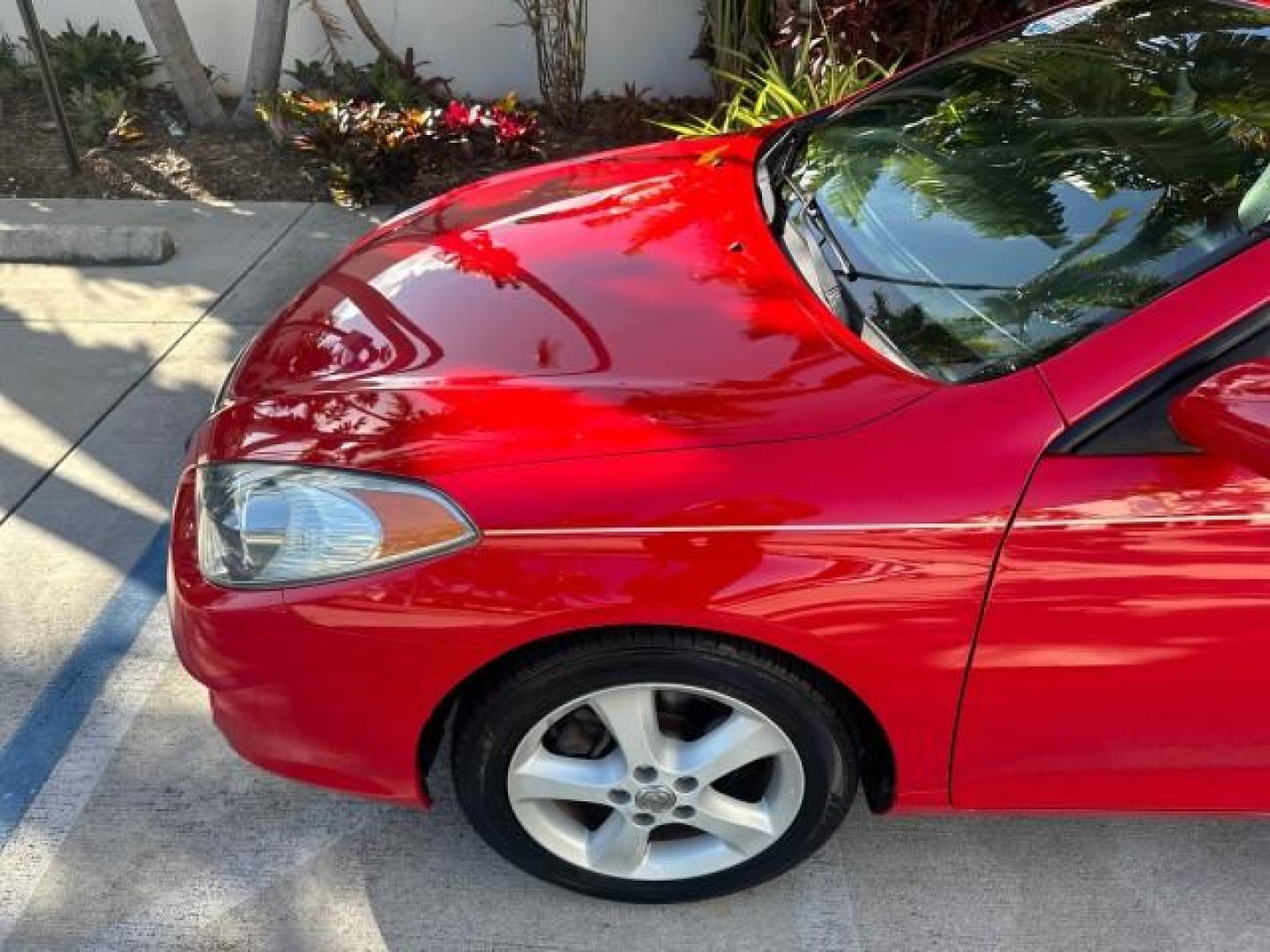 2004 Absolutely Red /Dark Stone Toyota Camry Solara 1 FL SLE LOW MILES 17,713 (4T1FA38P74U) with an 3.3L DOHC SMPI VVT-i 24-Valve V6 Engine engine, Automatic transmission, located at 4701 North Dixie Hwy, Pompano Beach, FL, 33064, (954) 422-2889, 26.240938, -80.123474 - OUR WEBPAGE FLORIDACARS1.COM HAS OVER 100 PHOTOS AND FREE CARFAX LINK 2004 TOYOTA CAMRY SOLARA SLE V6 VIN: 4T1FA38P74U024669 4 T 1 F A 3 8 P 7 4 U 0 2 4 6 6 9 CONVERTIBLE 3.3L V6 F DOHC 24V 29 MPG GASOLINE FRONT WHEEL DRIVE Top Features Alloy Wheels Leather Seats Front Seat Heaters Satellite Radio R - Photo#34
