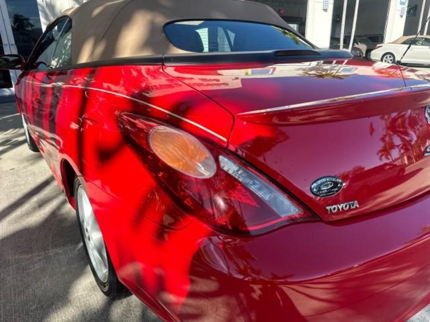 2004 Absolutely Red /Dark Stone Toyota Camry Solara 1 FL SLE LOW MILES 17,713 (4T1FA38P74U) with an 3.3L DOHC SMPI VVT-i 24-Valve V6 Engine engine, Automatic transmission, located at 4701 North Dixie Hwy, Pompano Beach, FL, 33064, (954) 422-2889, 26.240938, -80.123474 - OUR WEBPAGE FLORIDACARS1.COM HAS OVER 100 PHOTOS AND FREE CARFAX LINK 2004 TOYOTA CAMRY SOLARA SLE V6 VIN: 4T1FA38P74U024669 4 T 1 F A 3 8 P 7 4 U 0 2 4 6 6 9 CONVERTIBLE 3.3L V6 F DOHC 24V 29 MPG GASOLINE FRONT WHEEL DRIVE Top Features Alloy Wheels Leather Seats Front Seat Heaters Satellite Radio R - Photo#53