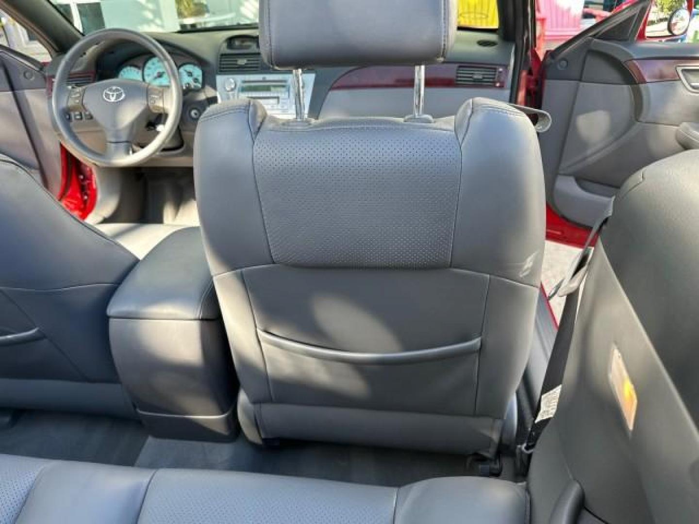 2004 Absolutely Red /Dark Stone Toyota Camry Solara 1 FL SLE LOW MILES 17,713 (4T1FA38P74U) with an 3.3L DOHC SMPI VVT-i 24-Valve V6 Engine engine, Automatic transmission, located at 4701 North Dixie Hwy, Pompano Beach, FL, 33064, (954) 422-2889, 26.240938, -80.123474 - OUR WEBPAGE FLORIDACARS1.COM HAS OVER 100 PHOTOS AND FREE CARFAX LINK 2004 TOYOTA CAMRY SOLARA SLE V6 VIN: 4T1FA38P74U024669 4 T 1 F A 3 8 P 7 4 U 0 2 4 6 6 9 CONVERTIBLE 3.3L V6 F DOHC 24V 29 MPG GASOLINE FRONT WHEEL DRIVE Top Features Alloy Wheels Leather Seats Front Seat Heaters Satellite Radio R - Photo#70