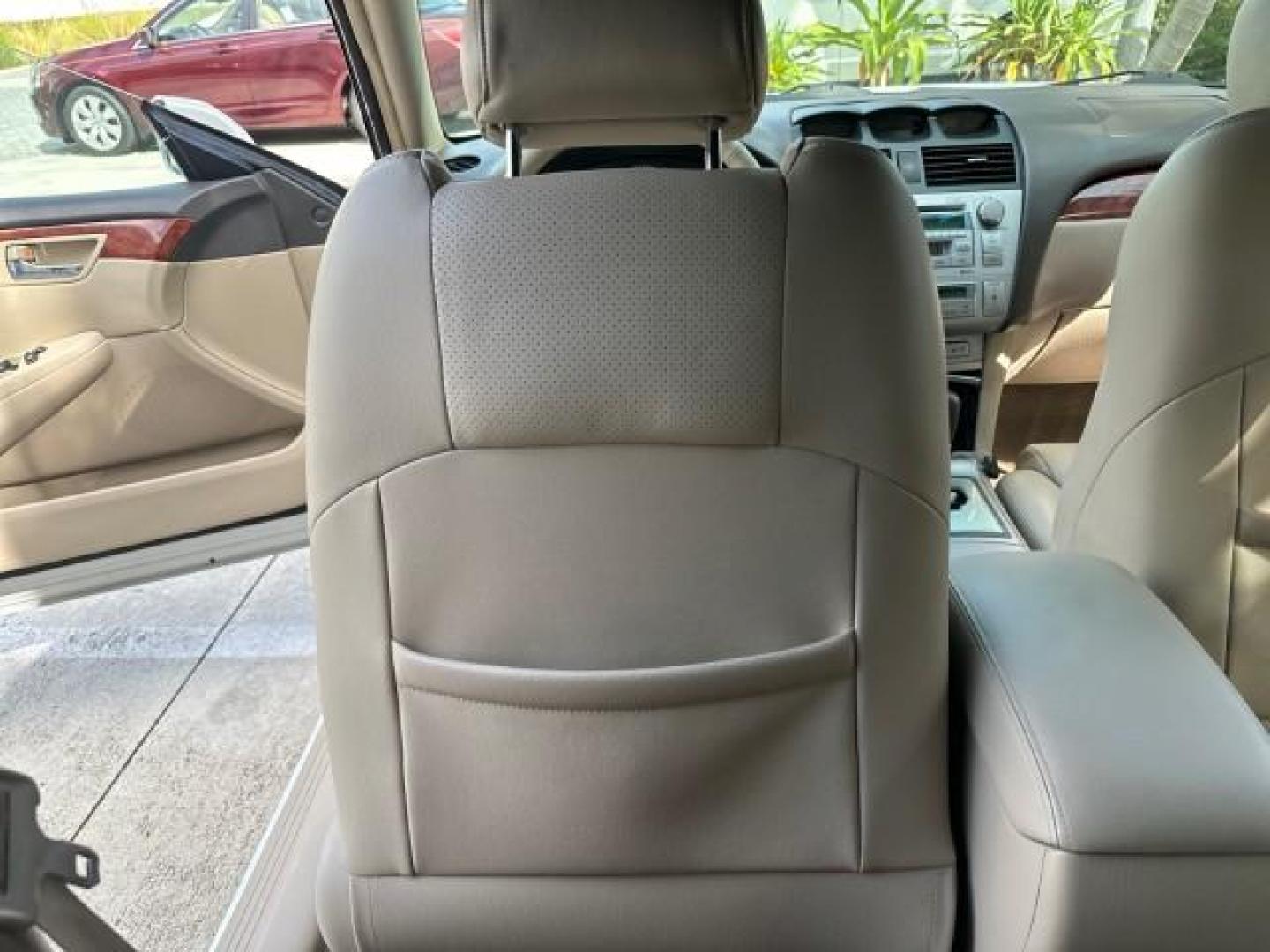 2006 Arctic Frost Pearl /Ivory Toyota Camry Solara LOW MILES 46,220 SLE V6 (4T1FA38P76U) with an 3.3L DOHC SMPI 24-Valve V6 Engine engine, Automatic transmission, located at 4701 North Dixie Hwy, Pompano Beach, FL, 33064, (954) 422-2889, 26.240938, -80.123474 - OUR WEBPAGE FLORIDACARS1.COM HAS OVER 100 PHOTOS AND FREE CARFAX LINK 2006 TOYOTA CAMRY SOLARA SLE V6 TOP OF THE LINE VIN: 4T1FA38P76U086754 4 T 1 F A 3 8 P 7 6 U 0 8 6 7 5 4 CONVERTIBLE 3.3L V6 F DOHC 24V GASOLINE 29 MPG FRONT WHEEL DRIVE Top Features Alloy Wheels Leather Seats Front Seat Heaters S - Photo#73