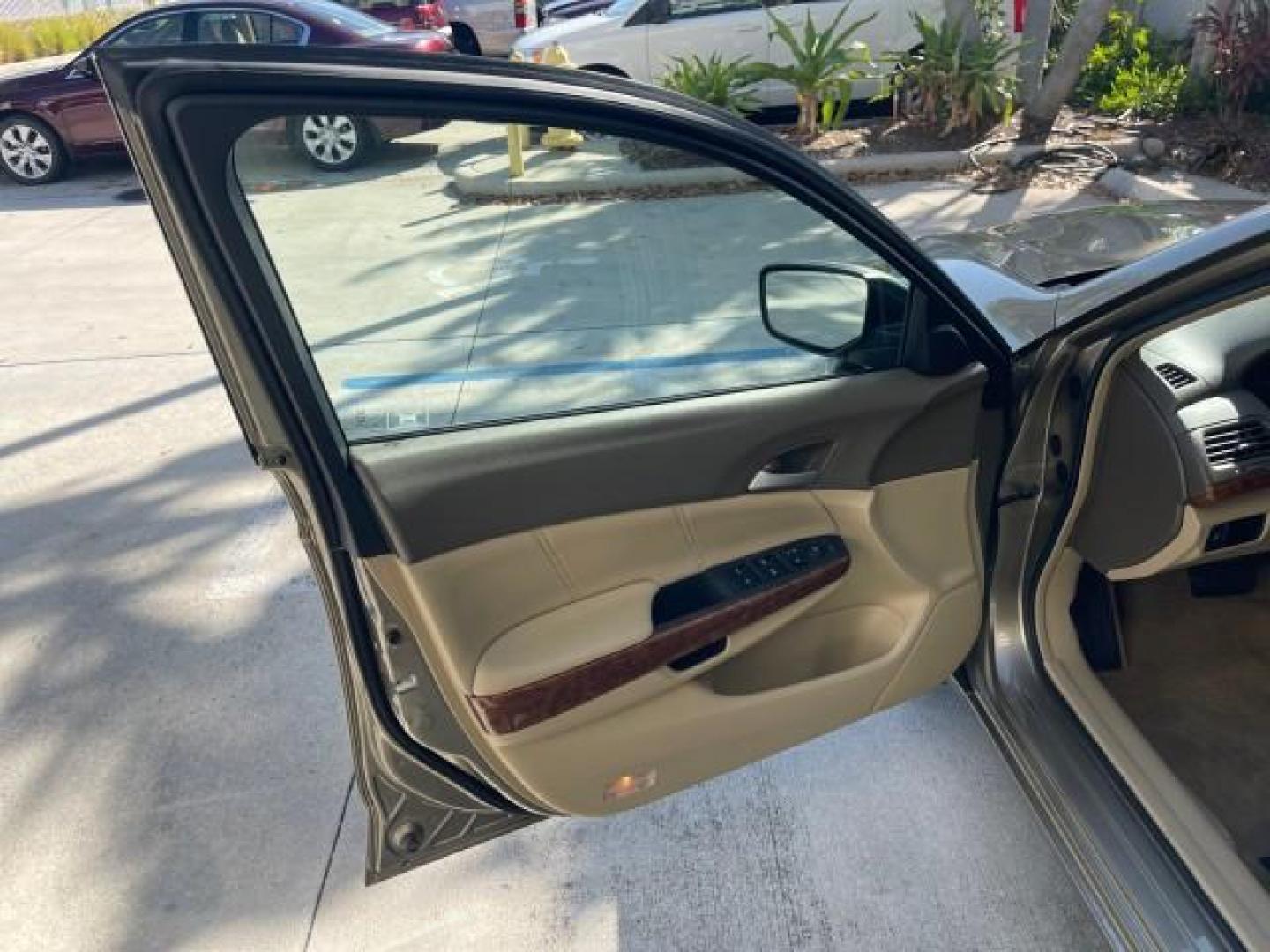 2009 Bold Beige Metallic /Ivory Honda Accord Sdn EX-L LOW MILES 31,501 (1HGCP26819A) with an 2.4L DOHC MPFI 16-Valve i-VTEC I4 Engine engine, Automatic transmission, located at 4701 North Dixie Hwy, Pompano Beach, FL, 33064, (954) 422-2889, 26.240938, -80.123474 - OUR WEBPAGE FLORIDACARS1.COM HAS OVER 100 PHOTOS AND FREE CARFAX LINK 2009 HONDA ACCORD EX-L VIN: 1HGCP26819A145607 1 H G C P 2 6 8 1 9 A 1 4 5 6 0 7 SEDAN 4 DR 2.4L I4 F DOHC 16V 31 MPG GASOLINE FRONT WHEEL DRIVE Top Features Alloy Wheels Satellite Radio Ready Front Seat Heaters Sunroof(s) Leather - Photo#9
