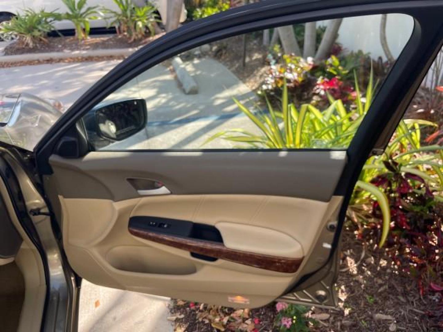 2009 Bold Beige Metallic /Ivory Honda Accord Sdn EX-L LOW MILES 31,501 (1HGCP26819A) with an 2.4L DOHC MPFI 16-Valve i-VTEC I4 Engine engine, Automatic transmission, located at 4701 North Dixie Hwy, Pompano Beach, FL, 33064, (954) 422-2889, 26.240938, -80.123474 - OUR WEBPAGE FLORIDACARS1.COM HAS OVER 100 PHOTOS AND FREE CARFAX LINK 2009 HONDA ACCORD EX-L VIN: 1HGCP26819A145607 1 H G C P 2 6 8 1 9 A 1 4 5 6 0 7 SEDAN 4 DR 2.4L I4 F DOHC 16V 31 MPG GASOLINE FRONT WHEEL DRIVE Top Features Alloy Wheels Satellite Radio Ready Front Seat Heaters Sunroof(s) Leather - Photo#11