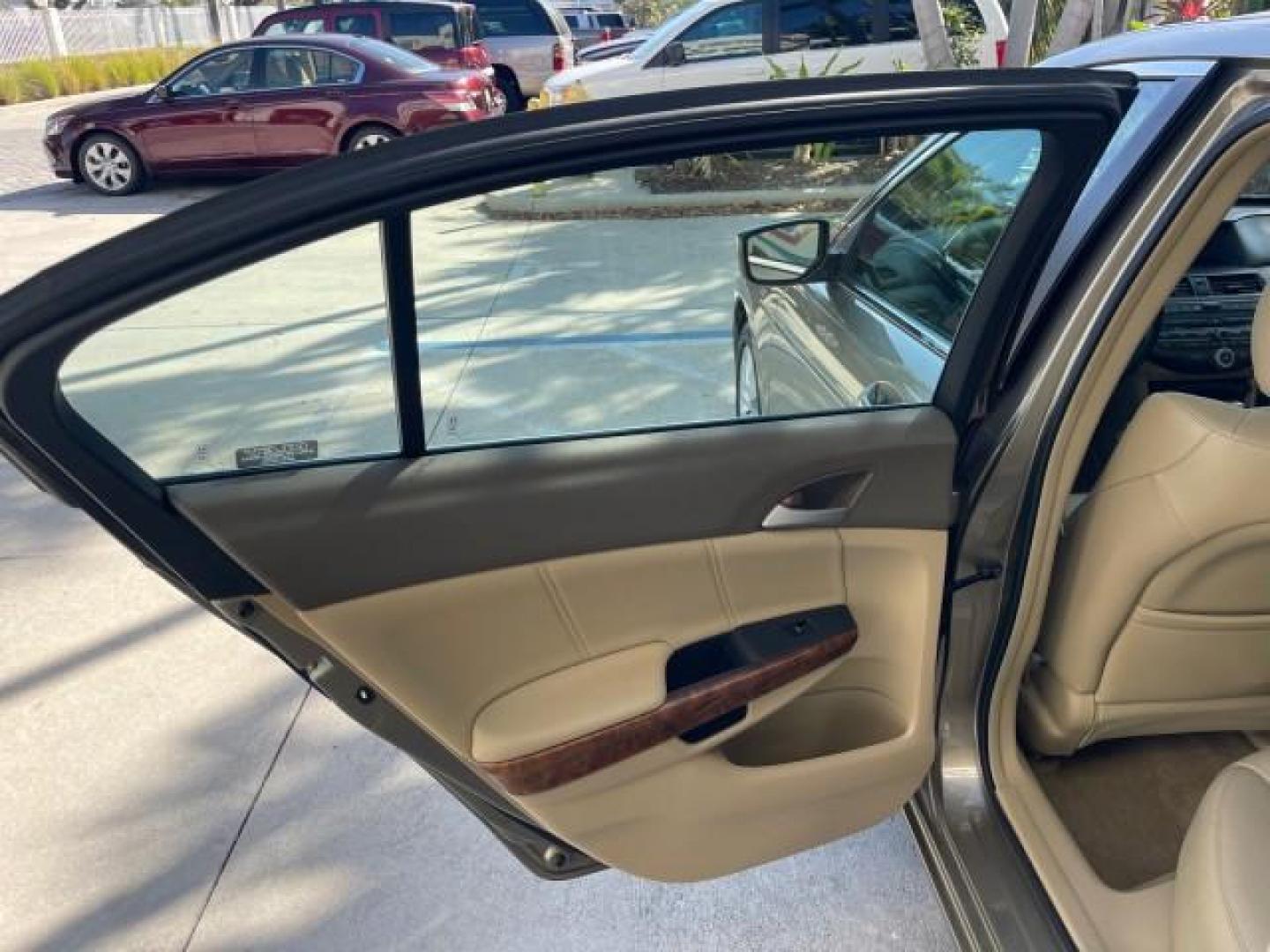 2009 Bold Beige Metallic /Ivory Honda Accord Sdn EX-L LOW MILES 31,501 (1HGCP26819A) with an 2.4L DOHC MPFI 16-Valve i-VTEC I4 Engine engine, Automatic transmission, located at 4701 North Dixie Hwy, Pompano Beach, FL, 33064, (954) 422-2889, 26.240938, -80.123474 - OUR WEBPAGE FLORIDACARS1.COM HAS OVER 100 PHOTOS AND FREE CARFAX LINK 2009 HONDA ACCORD EX-L VIN: 1HGCP26819A145607 1 H G C P 2 6 8 1 9 A 1 4 5 6 0 7 SEDAN 4 DR 2.4L I4 F DOHC 16V 31 MPG GASOLINE FRONT WHEEL DRIVE Top Features Alloy Wheels Satellite Radio Ready Front Seat Heaters Sunroof(s) Leather - Photo#13