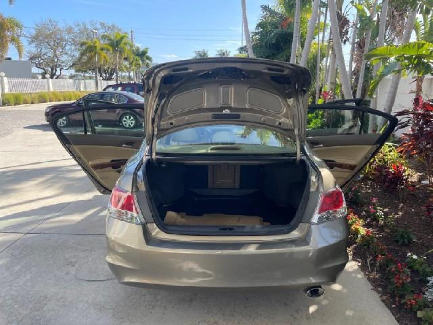 2009 Bold Beige Metallic /Ivory Honda Accord Sdn EX-L LOW MILES 31,501 (1HGCP26819A) with an 2.4L DOHC MPFI 16-Valve i-VTEC I4 Engine engine, Automatic transmission, located at 4701 North Dixie Hwy, Pompano Beach, FL, 33064, (954) 422-2889, 26.240938, -80.123474 - OUR WEBPAGE FLORIDACARS1.COM HAS OVER 100 PHOTOS AND FREE CARFAX LINK 2009 HONDA ACCORD EX-L VIN: 1HGCP26819A145607 1 H G C P 2 6 8 1 9 A 1 4 5 6 0 7 SEDAN 4 DR 2.4L I4 F DOHC 16V 31 MPG GASOLINE FRONT WHEEL DRIVE Top Features Alloy Wheels Satellite Radio Ready Front Seat Heaters Sunroof(s) Leather - Photo#15