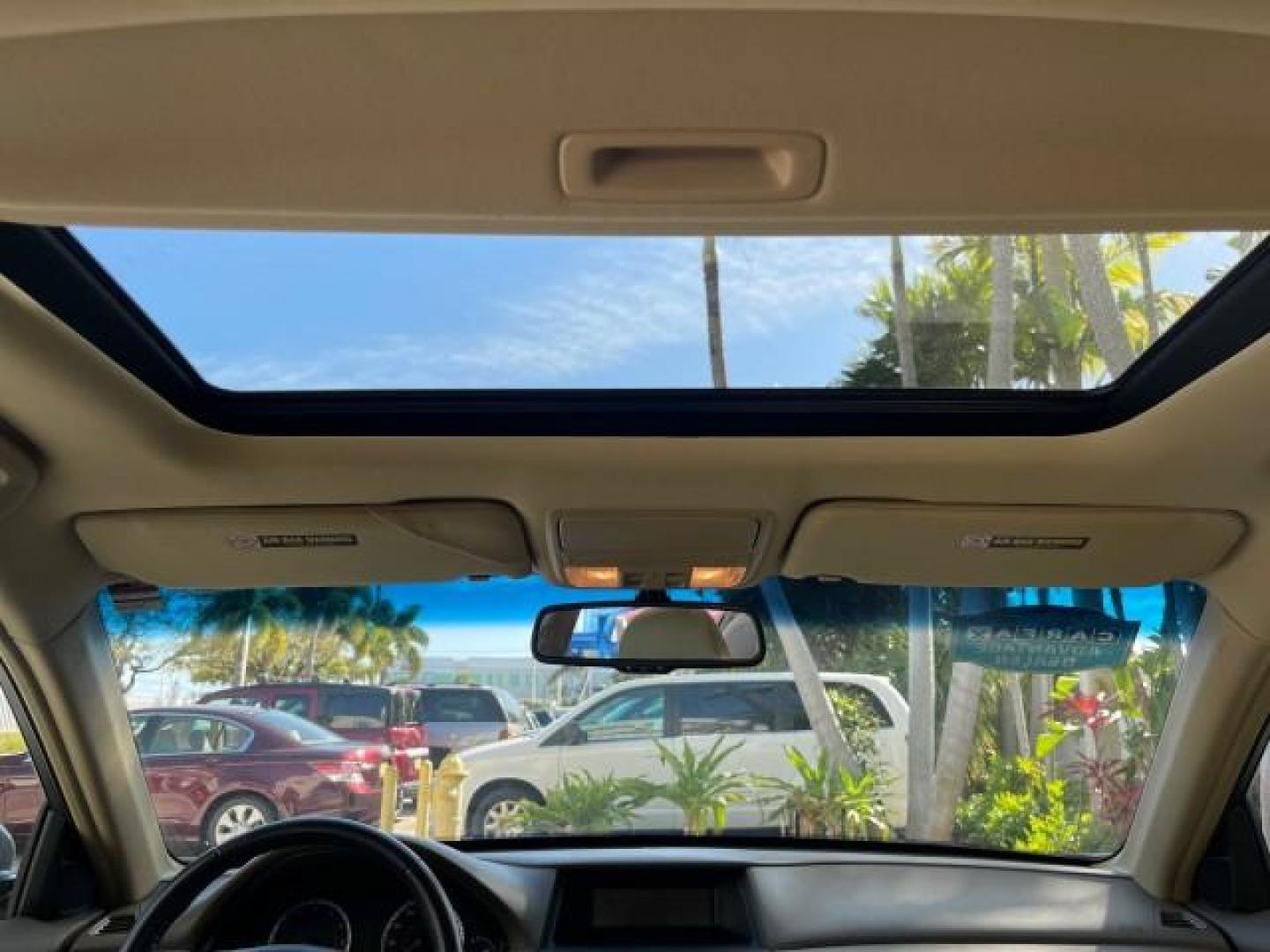 2009 Bold Beige Metallic /Ivory Honda Accord Sdn EX-L LOW MILES 31,501 (1HGCP26819A) with an 2.4L DOHC MPFI 16-Valve i-VTEC I4 Engine engine, Automatic transmission, located at 4701 North Dixie Hwy, Pompano Beach, FL, 33064, (954) 422-2889, 26.240938, -80.123474 - OUR WEBPAGE FLORIDACARS1.COM HAS OVER 100 PHOTOS AND FREE CARFAX LINK 2009 HONDA ACCORD EX-L VIN: 1HGCP26819A145607 1 H G C P 2 6 8 1 9 A 1 4 5 6 0 7 SEDAN 4 DR 2.4L I4 F DOHC 16V 31 MPG GASOLINE FRONT WHEEL DRIVE Top Features Alloy Wheels Satellite Radio Ready Front Seat Heaters Sunroof(s) Leather - Photo#70