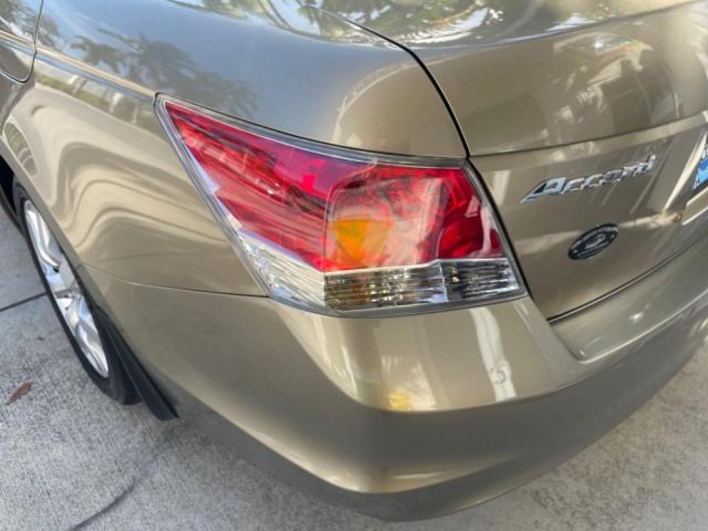 2009 Bold Beige Metallic /Ivory Honda Accord Sdn EX-L LOW MILES 31,501 (1HGCP26819A) with an 2.4L DOHC MPFI 16-Valve i-VTEC I4 Engine engine, Automatic transmission, located at 4701 North Dixie Hwy, Pompano Beach, FL, 33064, (954) 422-2889, 26.240938, -80.123474 - OUR WEBPAGE FLORIDACARS1.COM HAS OVER 100 PHOTOS AND FREE CARFAX LINK 2009 HONDA ACCORD EX-L VIN: 1HGCP26819A145607 1 H G C P 2 6 8 1 9 A 1 4 5 6 0 7 SEDAN 4 DR 2.4L I4 F DOHC 16V 31 MPG GASOLINE FRONT WHEEL DRIVE Top Features Alloy Wheels Satellite Radio Ready Front Seat Heaters Sunroof(s) Leather - Photo#78
