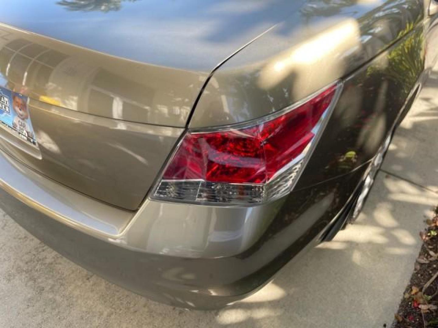 2009 Bold Beige Metallic /Ivory Honda Accord Sdn EX-L LOW MILES 31,501 (1HGCP26819A) with an 2.4L DOHC MPFI 16-Valve i-VTEC I4 Engine engine, Automatic transmission, located at 4701 North Dixie Hwy, Pompano Beach, FL, 33064, (954) 422-2889, 26.240938, -80.123474 - OUR WEBPAGE FLORIDACARS1.COM HAS OVER 100 PHOTOS AND FREE CARFAX LINK 2009 HONDA ACCORD EX-L VIN: 1HGCP26819A145607 1 H G C P 2 6 8 1 9 A 1 4 5 6 0 7 SEDAN 4 DR 2.4L I4 F DOHC 16V 31 MPG GASOLINE FRONT WHEEL DRIVE Top Features Alloy Wheels Satellite Radio Ready Front Seat Heaters Sunroof(s) Leather - Photo#85