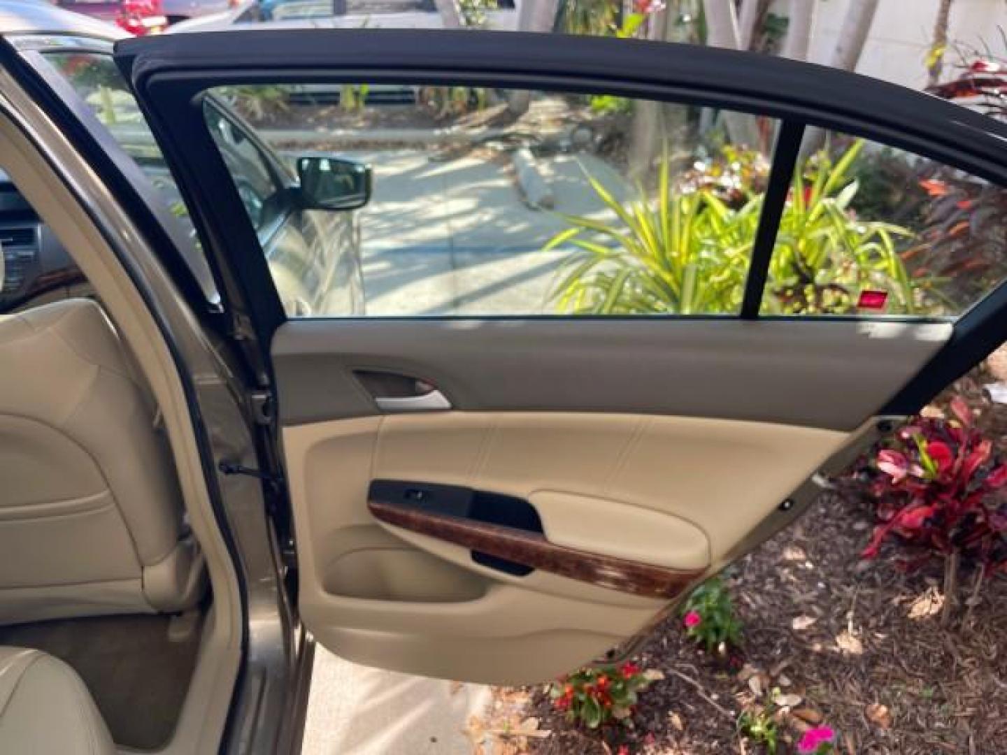 2009 Bold Beige Metallic /Ivory Honda Accord Sdn EX-L LOW MILES 31,501 (1HGCP26819A) with an 2.4L DOHC MPFI 16-Valve i-VTEC I4 Engine engine, Automatic transmission, located at 4701 North Dixie Hwy, Pompano Beach, FL, 33064, (954) 422-2889, 26.240938, -80.123474 - OUR WEBPAGE FLORIDACARS1.COM HAS OVER 100 PHOTOS AND FREE CARFAX LINK 2009 HONDA ACCORD EX-L VIN: 1HGCP26819A145607 1 H G C P 2 6 8 1 9 A 1 4 5 6 0 7 SEDAN 4 DR 2.4L I4 F DOHC 16V 31 MPG GASOLINE FRONT WHEEL DRIVE Top Features Alloy Wheels Satellite Radio Ready Front Seat Heaters Sunroof(s) Leather - Photo#88