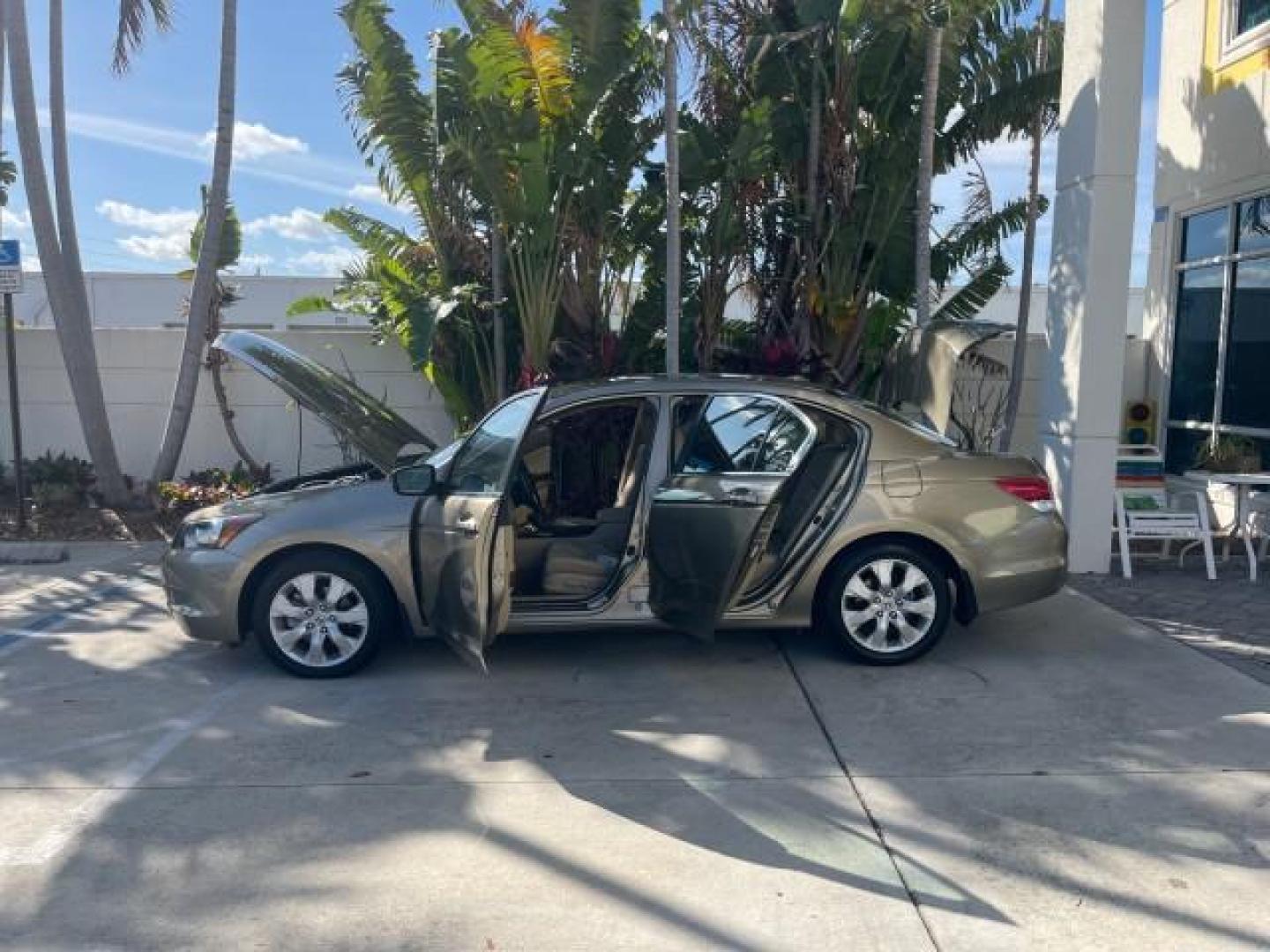 2009 Bold Beige Metallic /Ivory Honda Accord Sdn EX-L LOW MILES 31,501 (1HGCP26819A) with an 2.4L DOHC MPFI 16-Valve i-VTEC I4 Engine engine, Automatic transmission, located at 4701 North Dixie Hwy, Pompano Beach, FL, 33064, (954) 422-2889, 26.240938, -80.123474 - OUR WEBPAGE FLORIDACARS1.COM HAS OVER 100 PHOTOS AND FREE CARFAX LINK 2009 HONDA ACCORD EX-L VIN: 1HGCP26819A145607 1 H G C P 2 6 8 1 9 A 1 4 5 6 0 7 SEDAN 4 DR 2.4L I4 F DOHC 16V 31 MPG GASOLINE FRONT WHEEL DRIVE Top Features Alloy Wheels Satellite Radio Ready Front Seat Heaters Sunroof(s) Leather - Photo#8