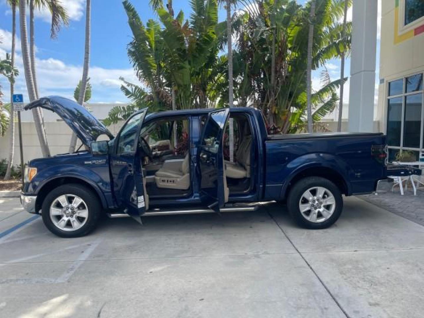 2010 Dark Blue Pearl Metallic /Tan Ford F-150 Lariat LOW MILES 60,628 NAV (1FTFW1CV4AF) with an 5.4L 3v EFI V8 FFV Engine engine, Automatic transmission, located at 4701 North Dixie Hwy, Pompano Beach, FL, 33064, (954) 422-2889, 26.240938, -80.123474 - OUR WEBPAGE FLORIDACARS1.COM HAS OVER 100 PHOTOS AND FREE CARFAX LINK 2010 FORD F-150 LARIAT $ 40,380 NEW VIN: 1FTFW1CV4AFD92632 1 F T F W 1 C V 4 A F D 9 2 6 3 2 CREW PICKUP 5.4L V8 F SOHC 24V FLEX FUEL REAR WHEEL DRIVE TOW PKG NO RECALLS Top Features Navigation System Bed Cover Parking Sensors Bed - Photo#4