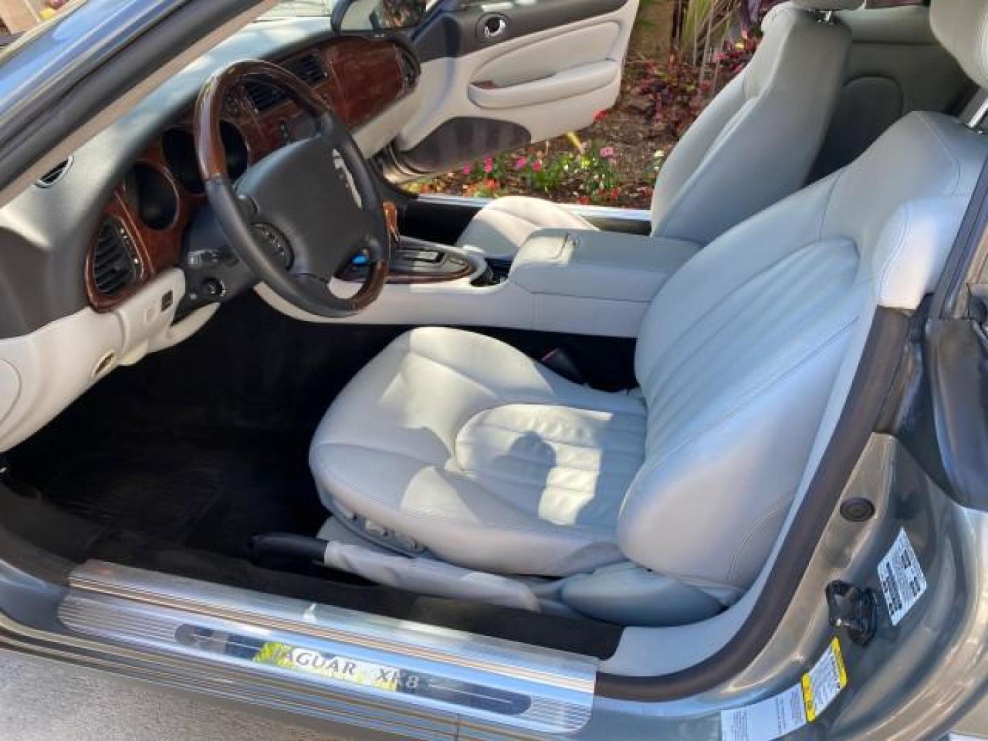 2003 Quartz /Dove Jaguar XK8 1 OWNER LOW MILES 37,004 (SAJDA42C132) with an 4.2L DOHC EFI 32-Valve Aluminum Alloy V8 Engine engine, Automatic transmission, located at 4701 North Dixie Hwy, Pompano Beach, FL, 33064, (954) 422-2889, 26.240938, -80.123474 - OUR WEBPAGE FLORIDACARS1.COM HAS OVER 100 PHOTOS AND FREE CARFAX LINK 2003 JAGUAR XK-SERIES XK8 $ 79,405 NEW ! VIN: SAJDA42C132A31624 S A J D A 4 2 C 1 3 2 A 3 1 6 2 4 CONVERTIBLE BOOT INCLUDED 4.2L V8 F DOHC GASOLINE REAR WHEEL DRIVE Top Features Alloy Wheels Leather Seats Alpine Sound System Navig - Photo#10
