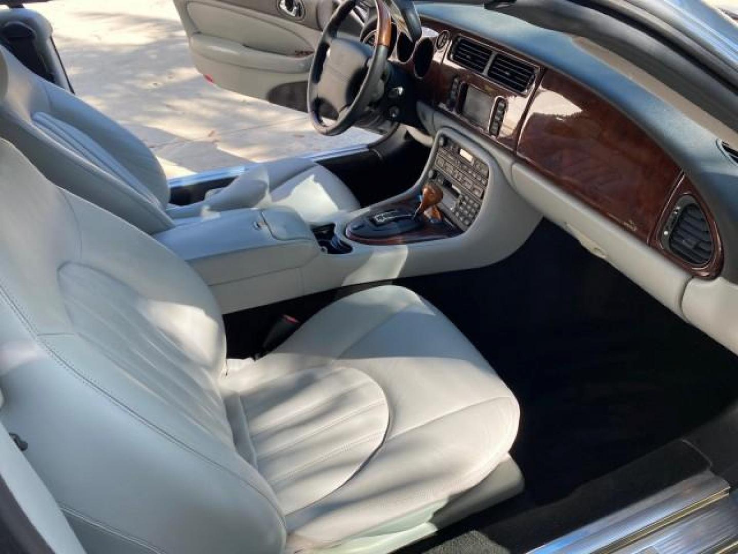 2003 Quartz /Dove Jaguar XK8 1 OWNER LOW MILES 37,004 (SAJDA42C132) with an 4.2L DOHC EFI 32-Valve Aluminum Alloy V8 Engine engine, Automatic transmission, located at 4701 North Dixie Hwy, Pompano Beach, FL, 33064, (954) 422-2889, 26.240938, -80.123474 - OUR WEBPAGE FLORIDACARS1.COM HAS OVER 100 PHOTOS AND FREE CARFAX LINK 2003 JAGUAR XK-SERIES XK8 $ 79,405 NEW ! VIN: SAJDA42C132A31624 S A J D A 4 2 C 1 3 2 A 3 1 6 2 4 CONVERTIBLE BOOT INCLUDED 4.2L V8 F DOHC GASOLINE REAR WHEEL DRIVE Top Features Alloy Wheels Leather Seats Alpine Sound System Navig - Photo#12
