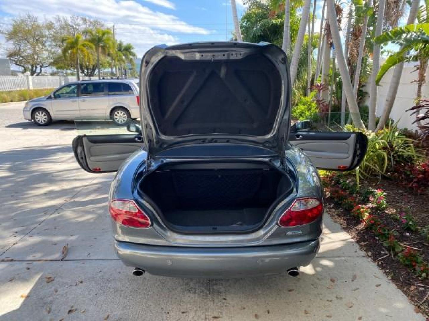 2003 Quartz /Dove Jaguar XK8 1 OWNER LOW MILES 37,004 (SAJDA42C132) with an 4.2L DOHC EFI 32-Valve Aluminum Alloy V8 Engine engine, Automatic transmission, located at 4701 North Dixie Hwy, Pompano Beach, FL, 33064, (954) 422-2889, 26.240938, -80.123474 - OUR WEBPAGE FLORIDACARS1.COM HAS OVER 100 PHOTOS AND FREE CARFAX LINK 2003 JAGUAR XK-SERIES XK8 $ 79,405 NEW ! VIN: SAJDA42C132A31624 S A J D A 4 2 C 1 3 2 A 3 1 6 2 4 CONVERTIBLE BOOT INCLUDED 4.2L V8 F DOHC GASOLINE REAR WHEEL DRIVE Top Features Alloy Wheels Leather Seats Alpine Sound System Navig - Photo#13