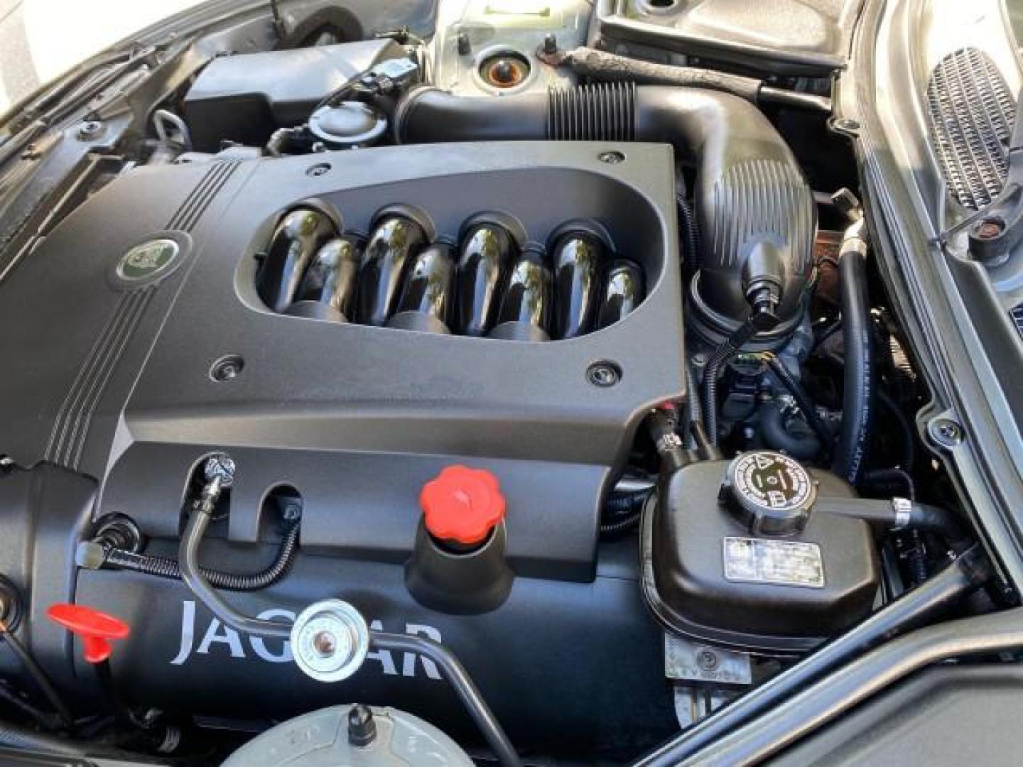 2003 Quartz /Dove Jaguar XK8 1 OWNER LOW MILES 37,004 (SAJDA42C132) with an 4.2L DOHC EFI 32-Valve Aluminum Alloy V8 Engine engine, Automatic transmission, located at 4701 North Dixie Hwy, Pompano Beach, FL, 33064, (954) 422-2889, 26.240938, -80.123474 - OUR WEBPAGE FLORIDACARS1.COM HAS OVER 100 PHOTOS AND FREE CARFAX LINK 2003 JAGUAR XK-SERIES XK8 $ 79,405 NEW ! VIN: SAJDA42C132A31624 S A J D A 4 2 C 1 3 2 A 3 1 6 2 4 CONVERTIBLE BOOT INCLUDED 4.2L V8 F DOHC GASOLINE REAR WHEEL DRIVE Top Features Alloy Wheels Leather Seats Alpine Sound System Navig - Photo#35