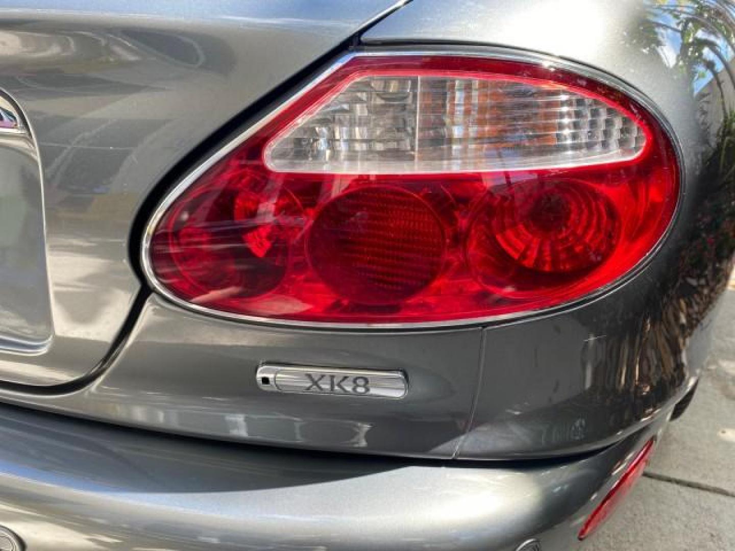 2003 Quartz /Dove Jaguar XK8 1 OWNER LOW MILES 37,004 (SAJDA42C132) with an 4.2L DOHC EFI 32-Valve Aluminum Alloy V8 Engine engine, Automatic transmission, located at 4701 North Dixie Hwy, Pompano Beach, FL, 33064, (954) 422-2889, 26.240938, -80.123474 - OUR WEBPAGE FLORIDACARS1.COM HAS OVER 100 PHOTOS AND FREE CARFAX LINK 2003 JAGUAR XK-SERIES XK8 $ 79,405 NEW ! VIN: SAJDA42C132A31624 S A J D A 4 2 C 1 3 2 A 3 1 6 2 4 CONVERTIBLE BOOT INCLUDED 4.2L V8 F DOHC GASOLINE REAR WHEEL DRIVE Top Features Alloy Wheels Leather Seats Alpine Sound System Navig - Photo#74