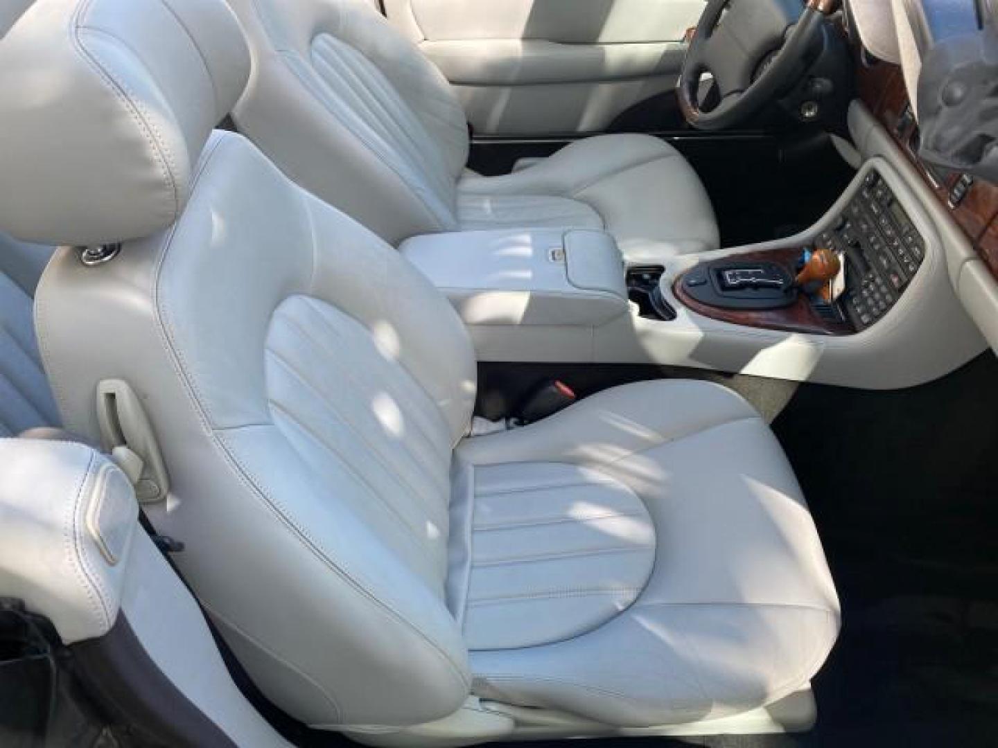 2003 Quartz /Dove Jaguar XK8 1 OWNER LOW MILES 37,004 (SAJDA42C132) with an 4.2L DOHC EFI 32-Valve Aluminum Alloy V8 Engine engine, Automatic transmission, located at 4701 North Dixie Hwy, Pompano Beach, FL, 33064, (954) 422-2889, 26.240938, -80.123474 - OUR WEBPAGE FLORIDACARS1.COM HAS OVER 100 PHOTOS AND FREE CARFAX LINK 2003 JAGUAR XK-SERIES XK8 $ 79,405 NEW ! VIN: SAJDA42C132A31624 S A J D A 4 2 C 1 3 2 A 3 1 6 2 4 CONVERTIBLE BOOT INCLUDED 4.2L V8 F DOHC GASOLINE REAR WHEEL DRIVE Top Features Alloy Wheels Leather Seats Alpine Sound System Navig - Photo#85