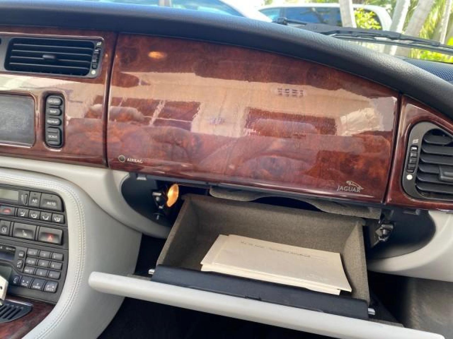2003 Quartz /Dove Jaguar XK8 1 OWNER LOW MILES 37,004 (SAJDA42C132) with an 4.2L DOHC EFI 32-Valve Aluminum Alloy V8 Engine engine, Automatic transmission, located at 4701 North Dixie Hwy, Pompano Beach, FL, 33064, (954) 422-2889, 26.240938, -80.123474 - OUR WEBPAGE FLORIDACARS1.COM HAS OVER 100 PHOTOS AND FREE CARFAX LINK 2003 JAGUAR XK-SERIES XK8 $ 79,405 NEW ! VIN: SAJDA42C132A31624 S A J D A 4 2 C 1 3 2 A 3 1 6 2 4 CONVERTIBLE BOOT INCLUDED 4.2L V8 F DOHC GASOLINE REAR WHEEL DRIVE Top Features Alloy Wheels Leather Seats Alpine Sound System Navig - Photo#91