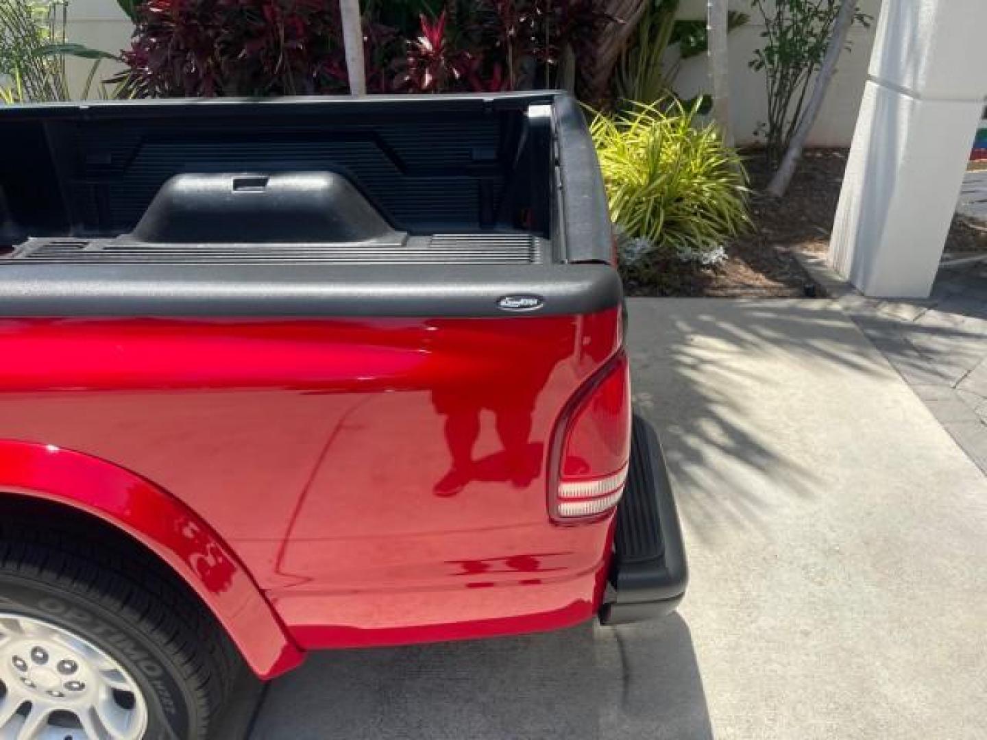 2003 Flame Red /Dark Slate Gray Dodge Dakota SXT FL OWNER LOW MILES 43,924 5 SPD (1D7FL16X43S) with an 3.9L V6 Cylinder Engine engine, Manual transmission, located at 4701 North Dixie Hwy, Pompano Beach, FL, 33064, (954) 422-2889, 26.240938, -80.123474 - OUR WEBPAGE FLORIDACARS1.COM HAS OVER 100 PHOTOS AND FREE CARFAX LINK 2003 DODGE DAKOTA VIN: 1D7FL16X43S306371 1 D 7 F L 1 6 X 4 3 S 3 0 6 3 7 1 PICKUP 75 INCH BED 3.9L V6 F OHV GASOLINE REAR WHEEL DRIVE Top Features Alloy Wheels Cloth Seats [-RETX] SXT QUICK-ORDER PKG SAVINGS *DISCOUNT* ($-1420.00) - Photo#61