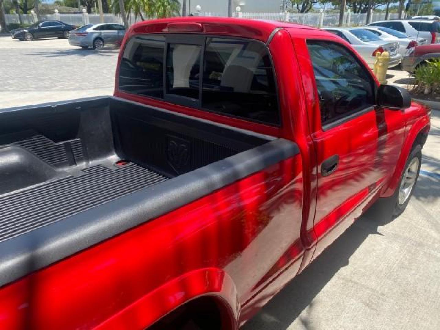 2003 Flame Red /Dark Slate Gray Dodge Dakota SXT FL OWNER LOW MILES 43,924 5 SPD (1D7FL16X43S) with an 3.9L V6 Cylinder Engine engine, Manual transmission, located at 4701 North Dixie Hwy, Pompano Beach, FL, 33064, (954) 422-2889, 26.240938, -80.123474 - OUR WEBPAGE FLORIDACARS1.COM HAS OVER 100 PHOTOS AND FREE CARFAX LINK 2003 DODGE DAKOTA VIN: 1D7FL16X43S306371 1 D 7 F L 1 6 X 4 3 S 3 0 6 3 7 1 PICKUP 75 INCH BED 3.9L V6 F OHV GASOLINE REAR WHEEL DRIVE Top Features Alloy Wheels Cloth Seats [-RETX] SXT QUICK-ORDER PKG SAVINGS *DISCOUNT* ($-1420.00) - Photo#78