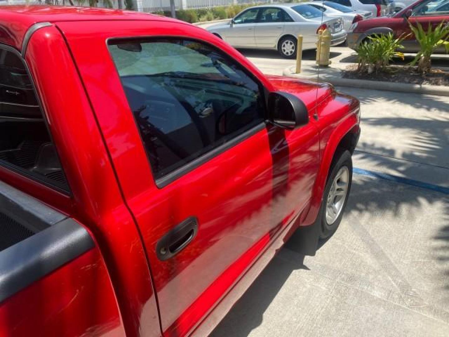 2003 Flame Red /Dark Slate Gray Dodge Dakota SXT FL OWNER LOW MILES 43,924 5 SPD (1D7FL16X43S) with an 3.9L V6 Cylinder Engine engine, Manual transmission, located at 4701 North Dixie Hwy, Pompano Beach, FL, 33064, (954) 422-2889, 26.240938, -80.123474 - OUR WEBPAGE FLORIDACARS1.COM HAS OVER 100 PHOTOS AND FREE CARFAX LINK 2003 DODGE DAKOTA VIN: 1D7FL16X43S306371 1 D 7 F L 1 6 X 4 3 S 3 0 6 3 7 1 PICKUP 75 INCH BED 3.9L V6 F OHV GASOLINE REAR WHEEL DRIVE Top Features Alloy Wheels Cloth Seats [-RETX] SXT QUICK-ORDER PKG SAVINGS *DISCOUNT* ($-1420.00) - Photo#84