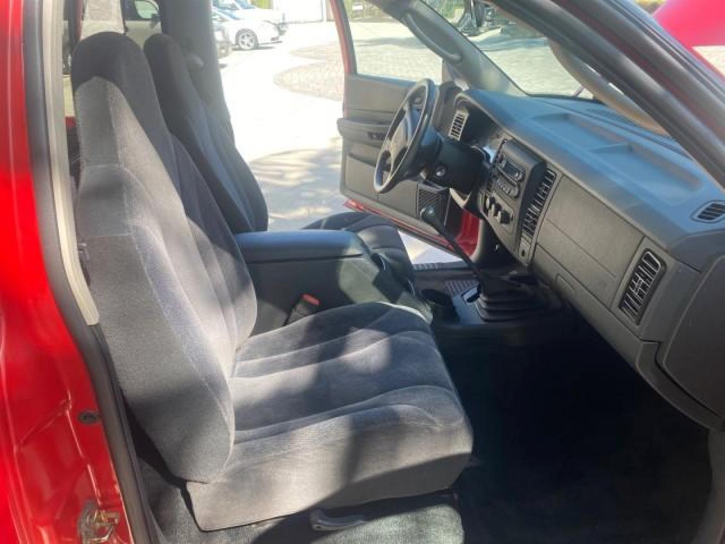 2003 Flame Red /Dark Slate Gray Dodge Dakota SXT FL OWNER LOW MILES 43,924 5 SPD (1D7FL16X43S) with an 3.9L V6 Cylinder Engine engine, Manual transmission, located at 4701 North Dixie Hwy, Pompano Beach, FL, 33064, (954) 422-2889, 26.240938, -80.123474 - OUR WEBPAGE FLORIDACARS1.COM HAS OVER 100 PHOTOS AND FREE CARFAX LINK 2003 DODGE DAKOTA VIN: 1D7FL16X43S306371 1 D 7 F L 1 6 X 4 3 S 3 0 6 3 7 1 PICKUP 75 INCH BED 3.9L V6 F OHV GASOLINE REAR WHEEL DRIVE Top Features Alloy Wheels Cloth Seats [-RETX] SXT QUICK-ORDER PKG SAVINGS *DISCOUNT* ($-1420.00) - Photo#13