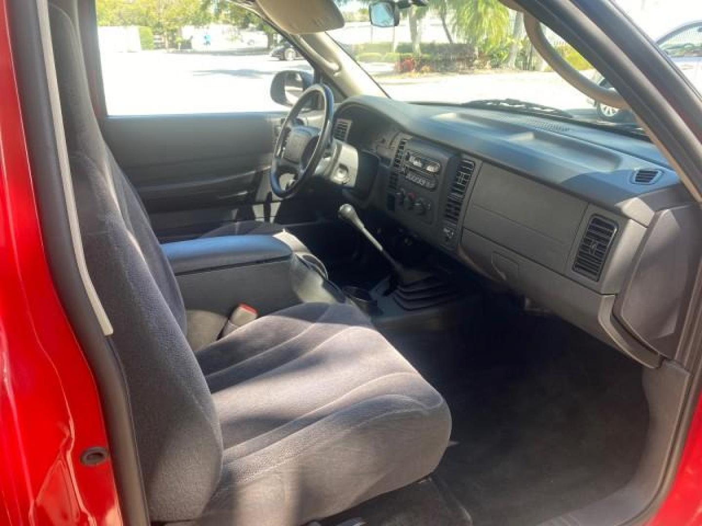 2003 Flame Red /Dark Slate Gray Dodge Dakota SXT FL OWNER LOW MILES 43,924 5 SPD (1D7FL16X43S) with an 3.9L V6 Cylinder Engine engine, Manual transmission, located at 4701 North Dixie Hwy, Pompano Beach, FL, 33064, (954) 422-2889, 26.240938, -80.123474 - OUR WEBPAGE FLORIDACARS1.COM HAS OVER 100 PHOTOS AND FREE CARFAX LINK 2003 DODGE DAKOTA VIN: 1D7FL16X43S306371 1 D 7 F L 1 6 X 4 3 S 3 0 6 3 7 1 PICKUP 75 INCH BED 3.9L V6 F OHV GASOLINE REAR WHEEL DRIVE Top Features Alloy Wheels Cloth Seats [-RETX] SXT QUICK-ORDER PKG SAVINGS *DISCOUNT* ($-1420.00) - Photo#96