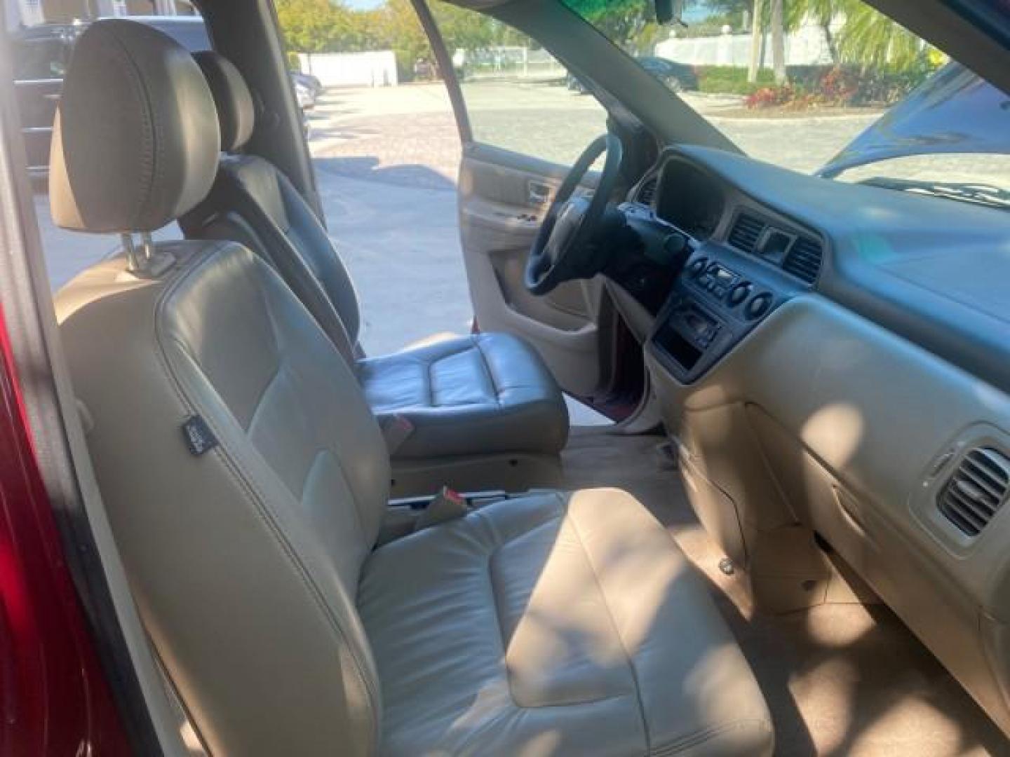 2004 Redrock Pearl /Ivory Honda Odyssey EX-L 1 OWNER FL LOW MILES 59,680 (5FNRL18994B) with an 3.5L SOHC MPFI 24-Valve VTEC V6 Engine engine, Automatic transmission, located at 4701 North Dixie Hwy, Pompano Beach, FL, 33064, (954) 422-2889, 26.240938, -80.123474 - OUR WEBPAGE FLORIDACARS1.COM HAS OVER 100 PHOTOS AND FREE CARFAX LINK 2004 HONDA ODYSSEY EX-L NO RECALLS VIN: 5FNRL18994B039314 5 F N R L 1 8 9 9 4 B 0 3 9 3 1 4 VAN 3.5L V6 F SOHC GASOLINE FRONT WHEEL DRIVE Alloy Wheels Quad Seats Fold-Away Third Row Rear Air Conditioning Leather Seats Third Row Se - Photo#12