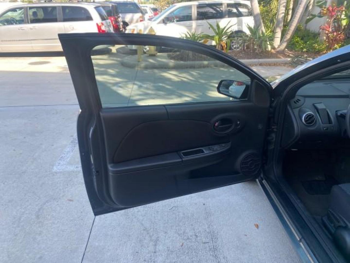 2007 Storm Gray /Black Saturn Ion 3 DR COUPE 1 OWNER FL LO MI 35,356 (1G8AN15F37Z) with an 2.2L DOHC MFI 16-Valve I4 Ecotec Engine engine, Automatic transmission, located at 4701 North Dixie Hwy, Pompano Beach, FL, 33064, (954) 422-2889, 26.240938, -80.123474 - OUR WEBPAGE FLORIDACARS1.COM HAS OVER 100 PHOTOS AND FREE CARFAX LINK VIN: 1G8AN15F37Z152136 1 G 8 A N 1 5 F 3 7 Z 1 5 2 1 3 6 COUPE 4 DR 2.2L I4 F GASOLINE 32 MPG FRONT WHEEL DRIVE Highlighted Features AM/FM Stereo Auxiliary Audio Input Power Locks Rear Defroster Air Conditioning CD Audio Power Mir - Photo#9