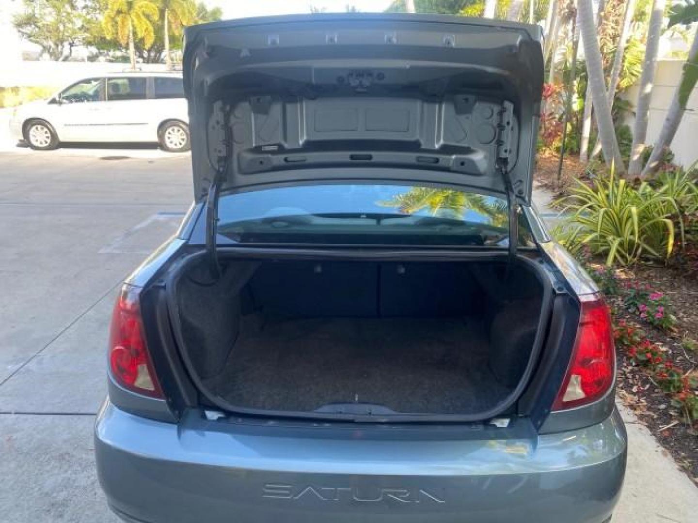 2007 Storm Gray /Black Saturn Ion 3 DR COUPE 1 OWNER FL LO MI 35,356 (1G8AN15F37Z) with an 2.2L DOHC MFI 16-Valve I4 Ecotec Engine engine, Automatic transmission, located at 4701 North Dixie Hwy, Pompano Beach, FL, 33064, (954) 422-2889, 26.240938, -80.123474 - OUR WEBPAGE FLORIDACARS1.COM HAS OVER 100 PHOTOS AND FREE CARFAX LINK VIN: 1G8AN15F37Z152136 1 G 8 A N 1 5 F 3 7 Z 1 5 2 1 3 6 COUPE 4 DR 2.2L I4 F GASOLINE 32 MPG FRONT WHEEL DRIVE Highlighted Features AM/FM Stereo Auxiliary Audio Input Power Locks Rear Defroster Air Conditioning CD Audio Power Mir - Photo#99