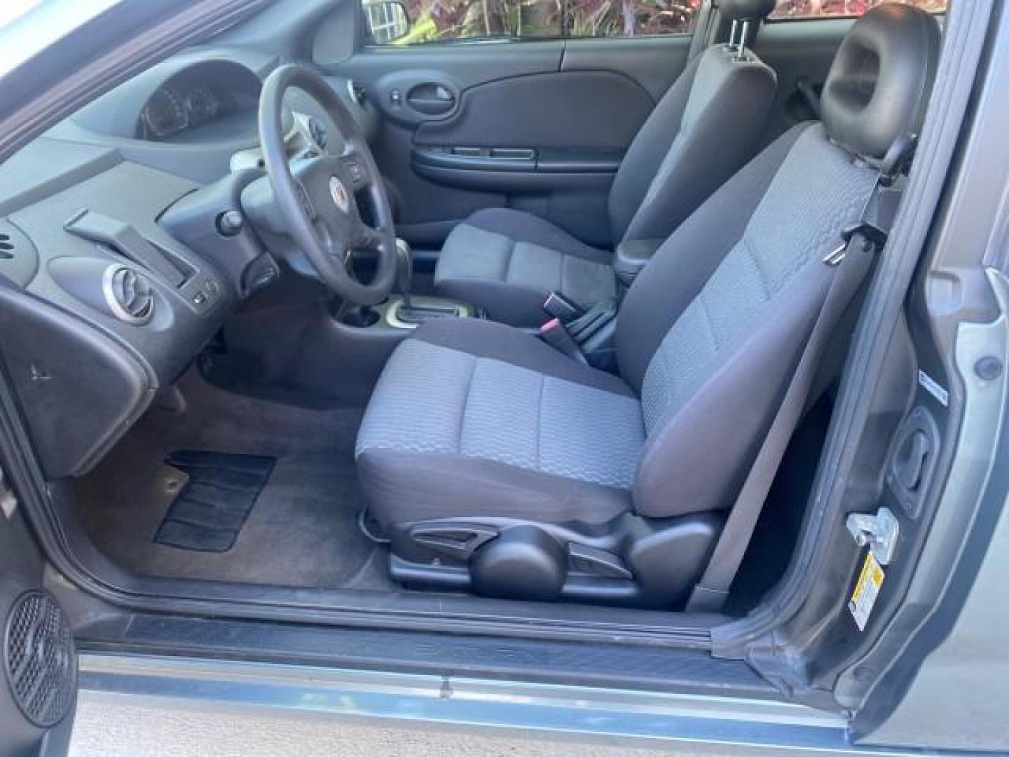 2007 Storm Gray /Black Saturn Ion 3 DR COUPE 1 OWNER FL LO MI 35,356 (1G8AN15F37Z) with an 2.2L DOHC MFI 16-Valve I4 Ecotec Engine engine, Automatic transmission, located at 4701 North Dixie Hwy, Pompano Beach, FL, 33064, (954) 422-2889, 26.240938, -80.123474 - OUR WEBPAGE FLORIDACARS1.COM HAS OVER 100 PHOTOS AND FREE CARFAX LINK VIN: 1G8AN15F37Z152136 1 G 8 A N 1 5 F 3 7 Z 1 5 2 1 3 6 COUPE 4 DR 2.2L I4 F GASOLINE 32 MPG FRONT WHEEL DRIVE Highlighted Features AM/FM Stereo Auxiliary Audio Input Power Locks Rear Defroster Air Conditioning CD Audio Power Mir - Photo#10