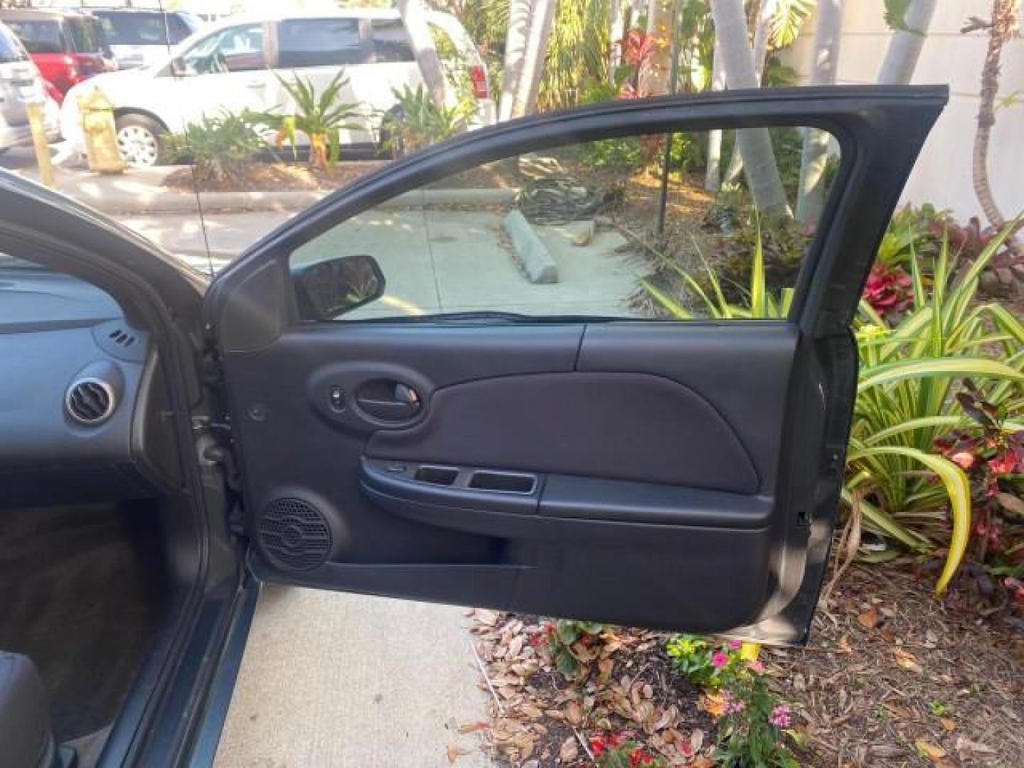2007 Storm Gray /Black Saturn Ion 3 DR COUPE 1 OWNER FL LO MI 35,356 (1G8AN15F37Z) with an 2.2L DOHC MFI 16-Valve I4 Ecotec Engine engine, Automatic transmission, located at 4701 North Dixie Hwy, Pompano Beach, FL, 33064, (954) 422-2889, 26.240938, -80.123474 - OUR WEBPAGE FLORIDACARS1.COM HAS OVER 100 PHOTOS AND FREE CARFAX LINK VIN: 1G8AN15F37Z152136 1 G 8 A N 1 5 F 3 7 Z 1 5 2 1 3 6 COUPE 4 DR 2.2L I4 F GASOLINE 32 MPG FRONT WHEEL DRIVE Highlighted Features AM/FM Stereo Auxiliary Audio Input Power Locks Rear Defroster Air Conditioning CD Audio Power Mir - Photo#11