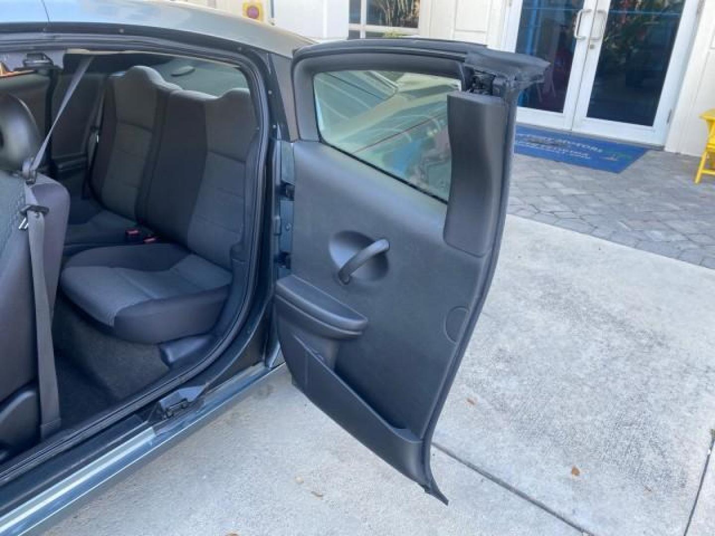 2007 Storm Gray /Black Saturn Ion 3 DR COUPE 1 OWNER FL LO MI 35,356 (1G8AN15F37Z) with an 2.2L DOHC MFI 16-Valve I4 Ecotec Engine engine, Automatic transmission, located at 4701 North Dixie Hwy, Pompano Beach, FL, 33064, (954) 422-2889, 26.240938, -80.123474 - OUR WEBPAGE FLORIDACARS1.COM HAS OVER 100 PHOTOS AND FREE CARFAX LINK VIN: 1G8AN15F37Z152136 1 G 8 A N 1 5 F 3 7 Z 1 5 2 1 3 6 COUPE 4 DR 2.2L I4 F GASOLINE 32 MPG FRONT WHEEL DRIVE Highlighted Features AM/FM Stereo Auxiliary Audio Input Power Locks Rear Defroster Air Conditioning CD Audio Power Mir - Photo#13
